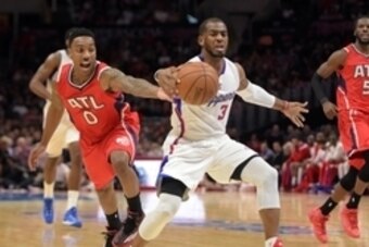 Jan 5, 2015; Los Angeles, CA, USA; Los Angeles Clippers guard Chris Paul (3) is defended by Atlanta Hawks guard Jeff Teague (0) at Staples Center. Mandatory Credit: Kirby Lee-USA TODAY Sports