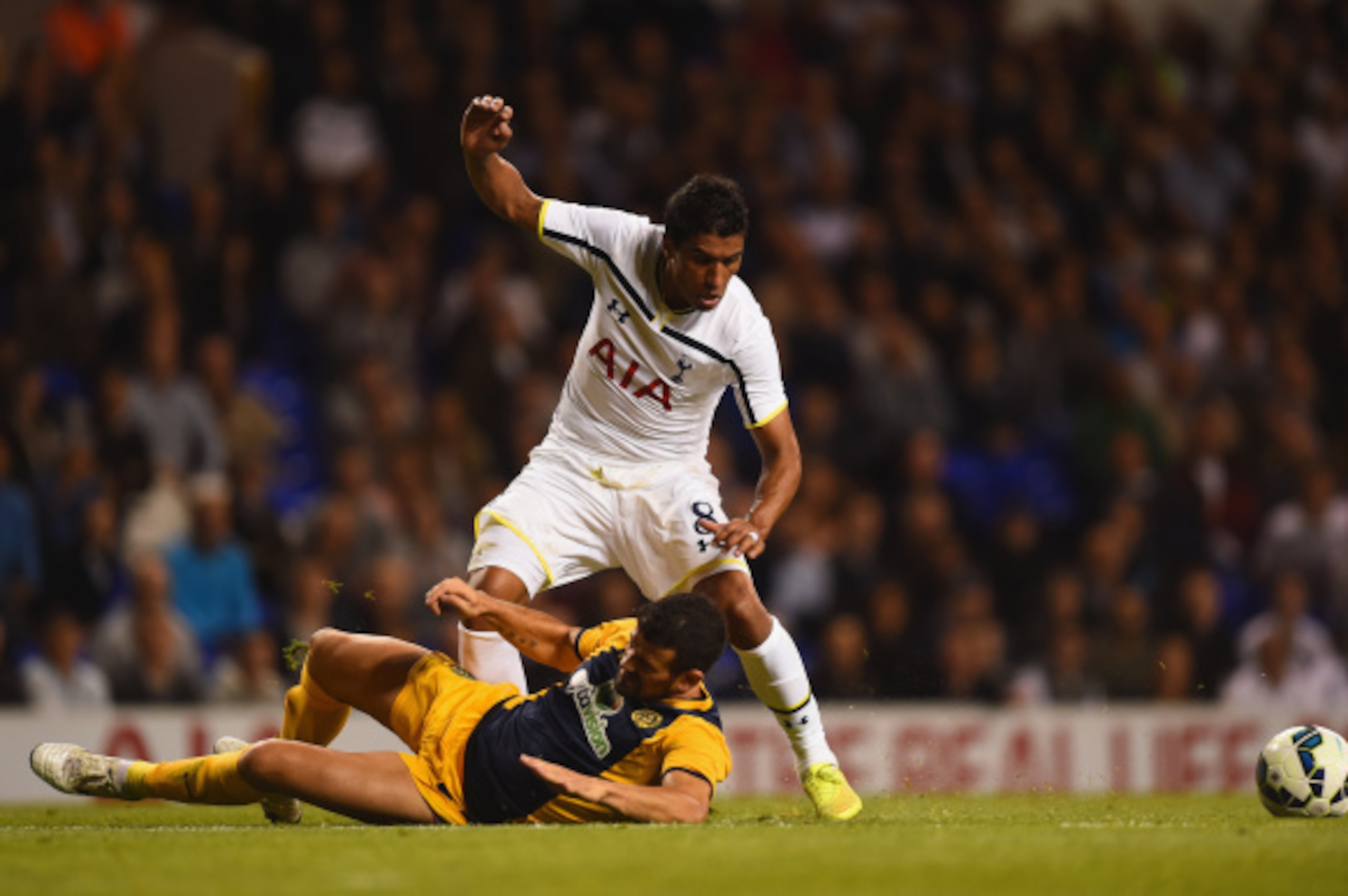 LONDON, ENGLAND - AUGUST 28: Paulinho of Spurs is tackled by Ricardo Manuel Ferreiras Sousa of AEL Limassol during the UEFA Europa League Qualifying Play-Offs Round Second Leg match between Tottenham Hotspur and AEL Limassol FC on August 28, 2014 in Lond LONDON, ENGLAND - AUGUST 28: Paulinho of Spurs is tackled by Ricardo Manuel Ferreiras Sousa of AEL Limassol during the UEFA Europa League Qualifying Play-Offs Round Second Leg match between Tottenham Hotspur and AEL Limassol FC on August 28, 2014 in Lond