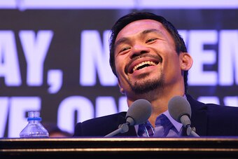 MACAU - NOVEMBER 23:  Manny Pacquiao of the Philippines speaks to media at the post fight press conference after winning against Chris Algieri of the United States during the WBO world welterweight title at The Venetian on November 23, 2014 in Macau, Maca