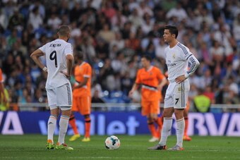 MADRID, SPAIN - MAY 04:  Cristiano Ronaldo and Karim Benzema of Real Madrid FC react after Valencia CF scored their 2nd goal during the La Liga match between Real Madrid CF and Valencia CF at Santiago Bernabeu stadium on May 4, 2014 in Madrid, Spain.  (Ph