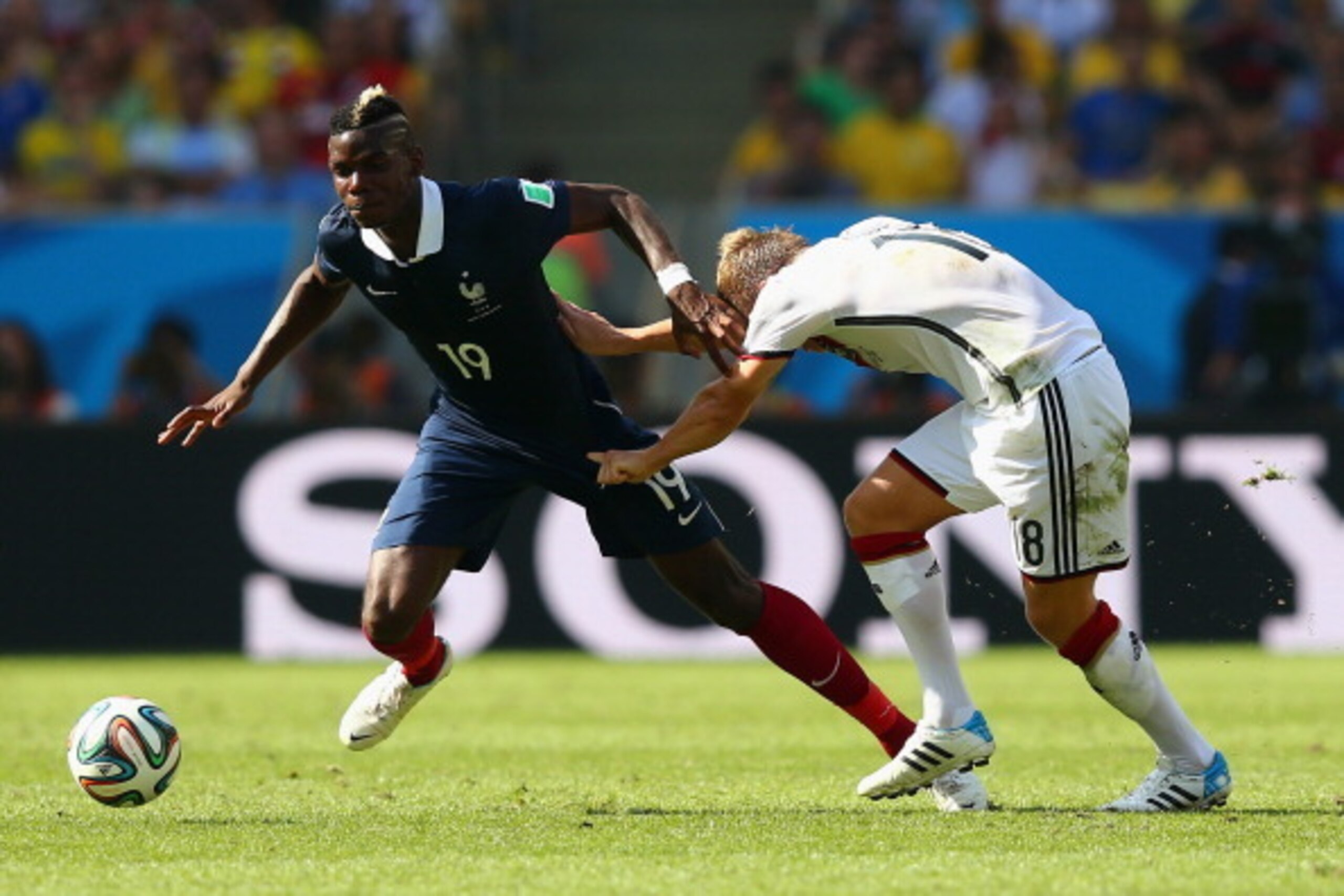 RIO DE JANEIRO, BRAZIL - JULY 04: Toni Kroos of Germany tussles Paul Pogba during the 2014 FIFA World Cup Brazil Quarter Final match between France and Germany at Maracana on July 4, 2014 in Rio de Janeiro, Brazil.  (Photo by Martin Rose/Getty Images)