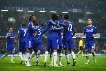 LONDON, ENGLAND - JANUARY 04:  Loic Remy of Chelsea (18) is congratulated by Kurt Zouma (5) and team mates as he scores their second goal during the FA Cup Third Round match between Chelsea and Watford at Stamford Bridge on January 4, 2015 in London, Engl