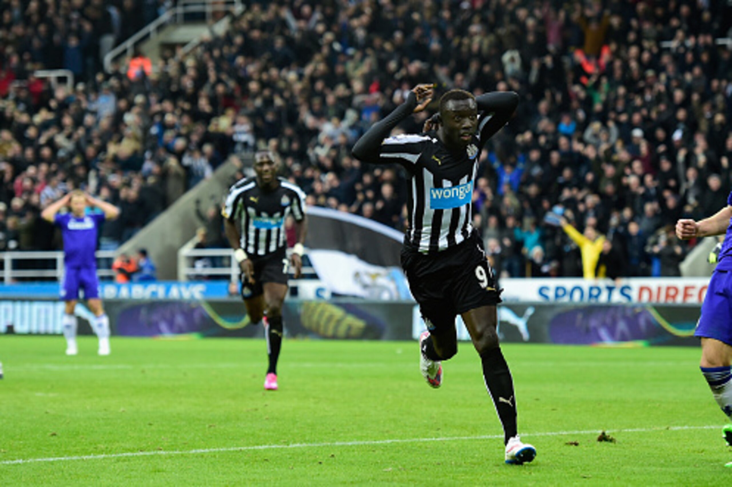 NEWCASTLE UPON TYNE, ENGLAND - DECEMBER 06:  Papiss Cisse of Newcastle  celebrates after scoring the second goal during the Barclays Premier League match between Newcastle United and Chelsea at St James' Park on December 6, 2014 in Newcastle upon Tyne, En