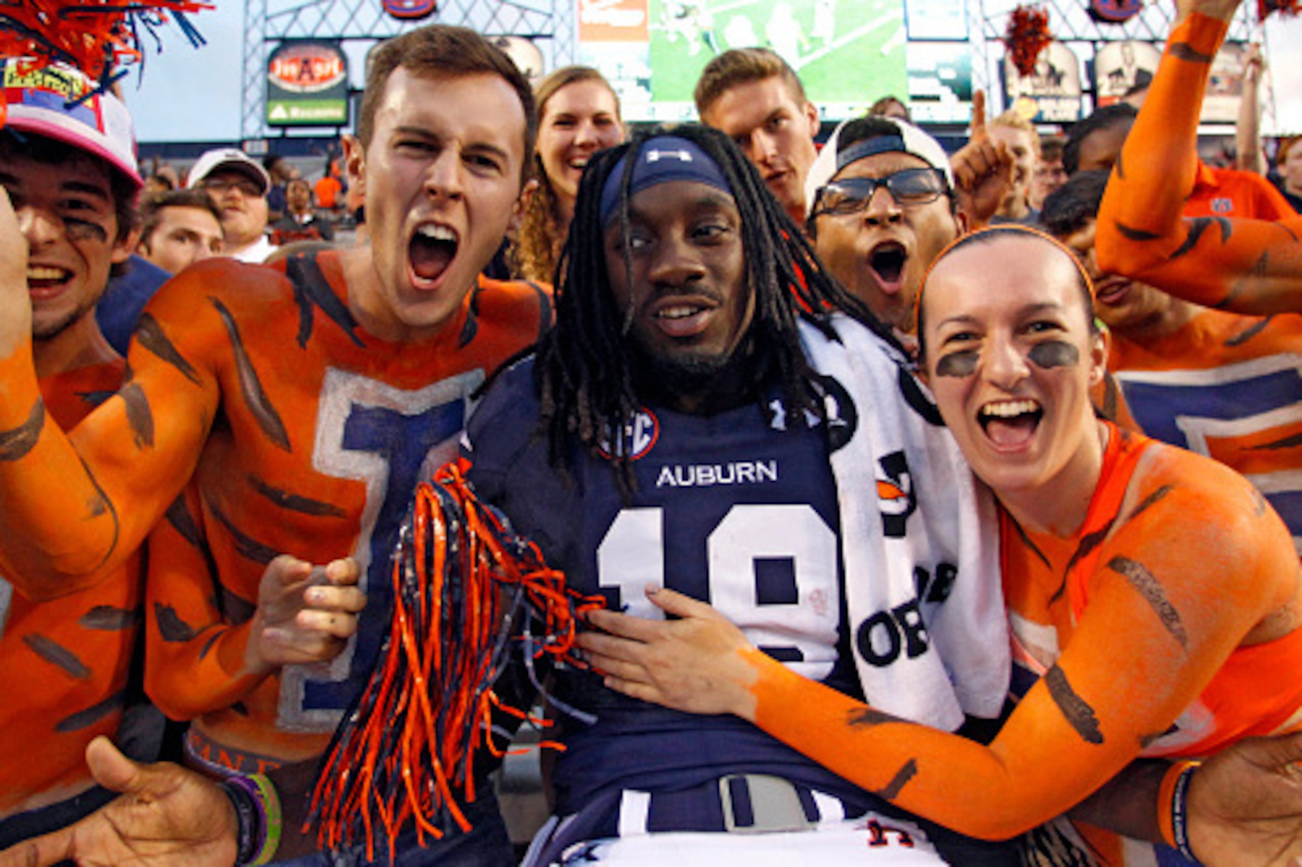 AUBURN, AL - SEPTEMBER 27: Wide receiver Sammie Coates #18 of the Auburn Tigers celebrates with fans after they defeated the Louisiana Tech Bulldogs 45-17 at Jordan Hare Stadium on September 27, 2014 in Auburn, Alabama. (Photo by Butch Dill/Getty Images) AUBURN, AL - SEPTEMBER 27: Wide receiver Sammie Coates #18 of the Auburn Tigers celebrates with fans after they defeated the Louisiana Tech Bulldogs 45-17 at Jordan Hare Stadium on September 27, 2014 in Auburn, Alabama. (Photo by Butch Dill/Getty Images)