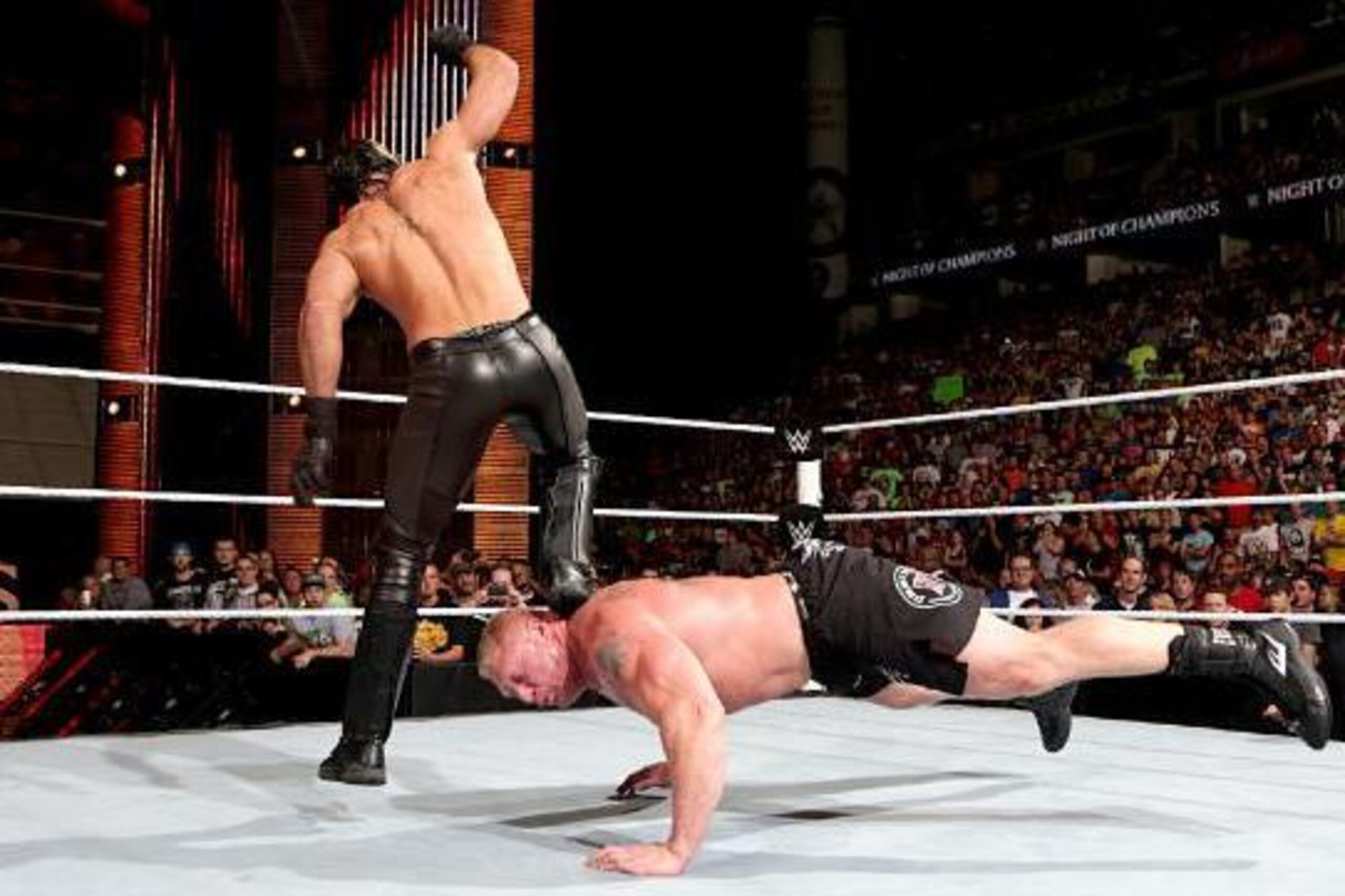 Seth Rollins attacks Brock Lesnar at Night of Champions. Seth Rollins attacks Brock Lesnar at Night of Champions.