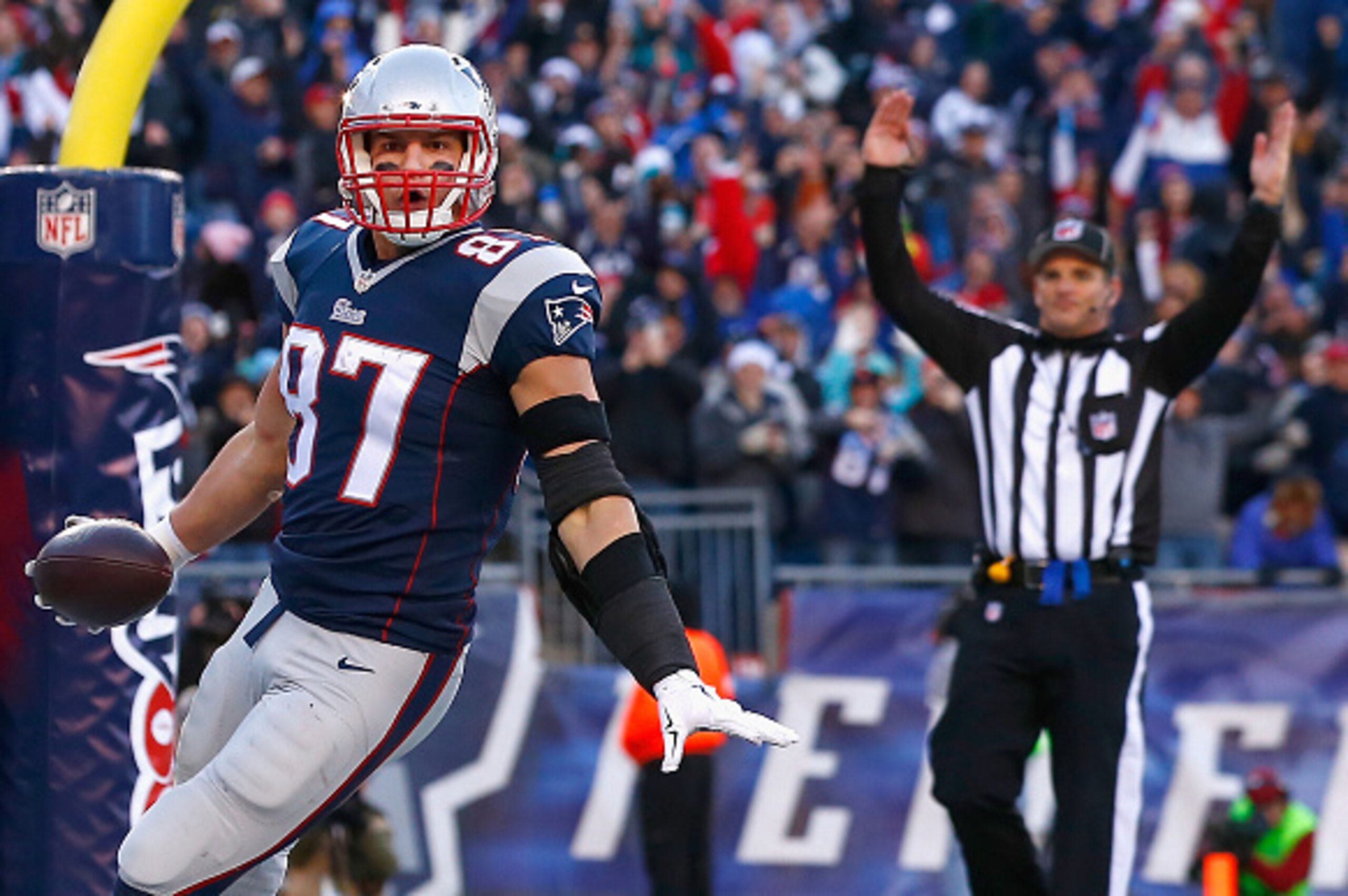 FOXBORO, MA - DECEMBER 14:  Rob Gronkowski #87 of the New England Patriots reacts after catching a touchdown pass during the third quarter against the Miami Dolphins at Gillette Stadium on December 14, 2014 in Foxboro, Massachusetts.  (Photo by Jared Wick