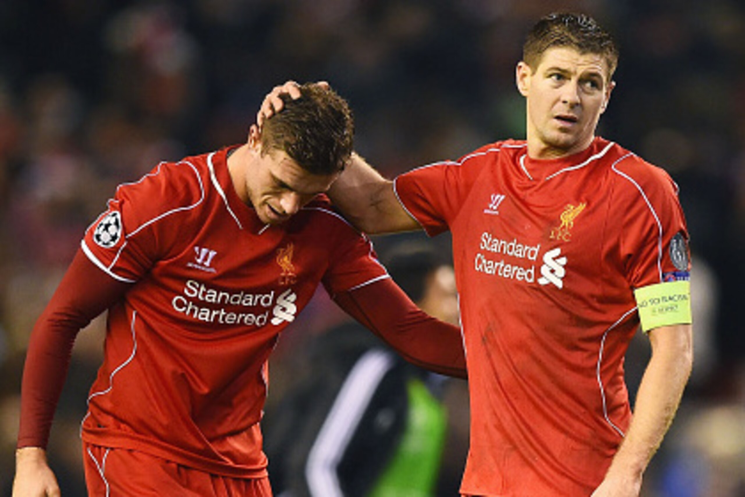 LIVERPOOL, ENGLAND - DECEMBER 09:  (L-R) Dejected Liverpool players Jordan Henderson and Steven Gerrard react following their team's 1-1 draw and exit from the competition during the UEFA Champions League group B match between Liverpool and FC Basel 1893 