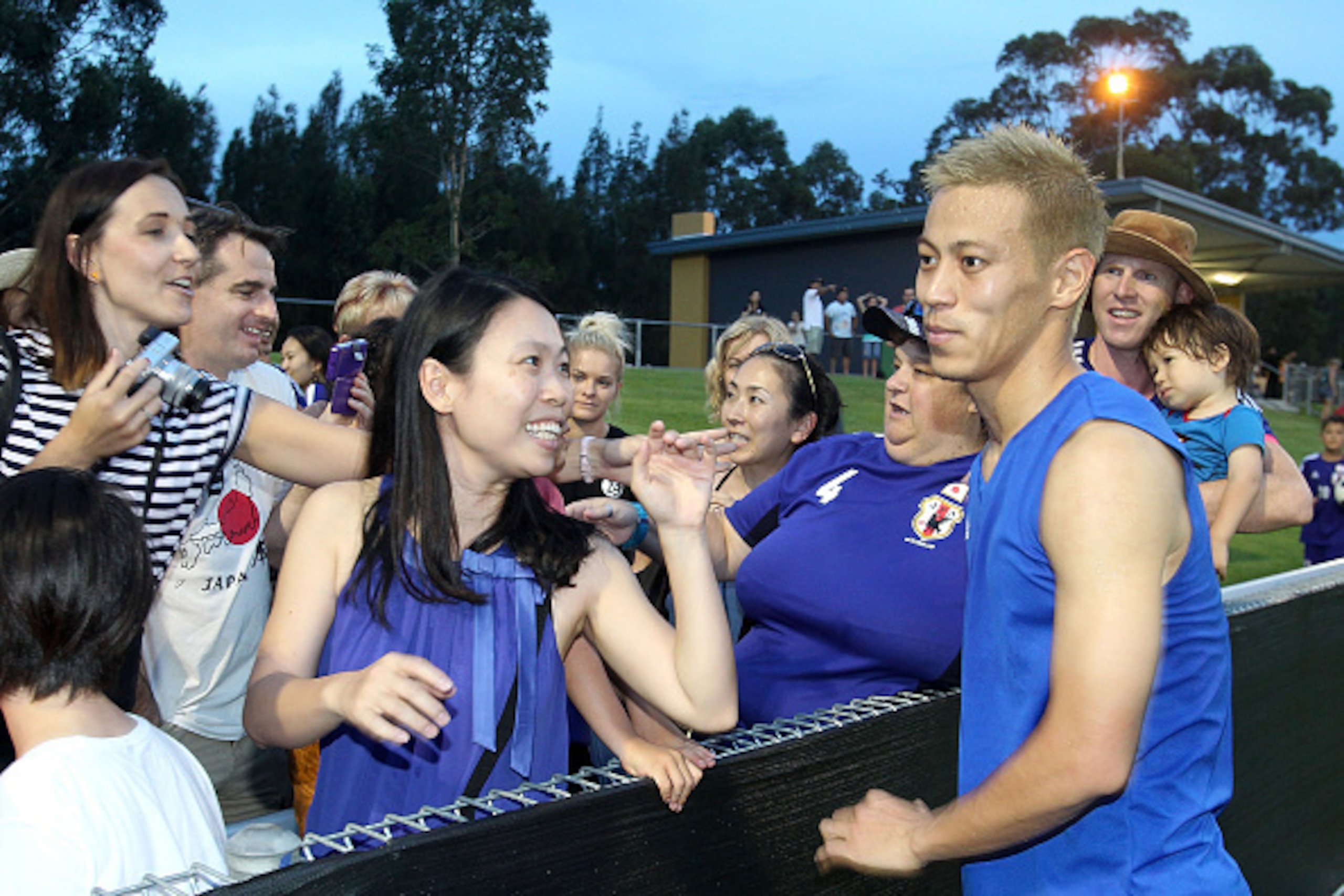 CESSNOCK, AUSTRALIA - JANUARY 04:  Keisuke Honda of Japan meets supporters after the Asian Cup practice match between Japan and Auckland City on January 4, 2015 in Cessnock, Australia.  (Photo by Tony Feder/Getty Images)