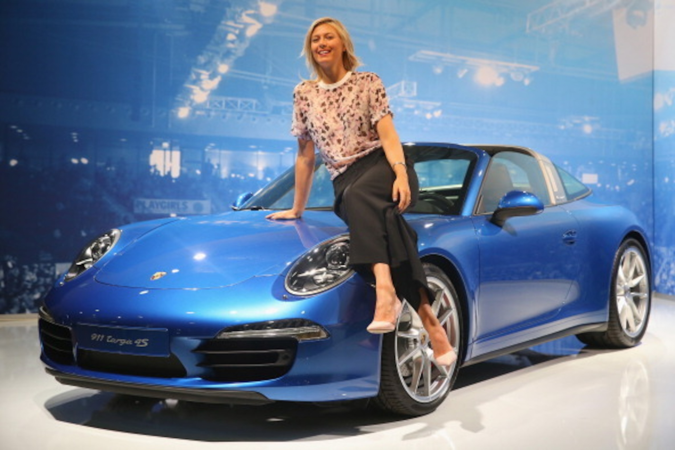 STUTTGART, GERMANY - APRIL 19:  Maria Sharapova, Porsche's global brand ambassador poses with the Porsche Tennis Grand Prix 2014 winners car, the Porsche targa 4s at the Porsche Arena on April 19, 2014 in Stuttgart, Germany.  (Photo by Alexander Hassenste