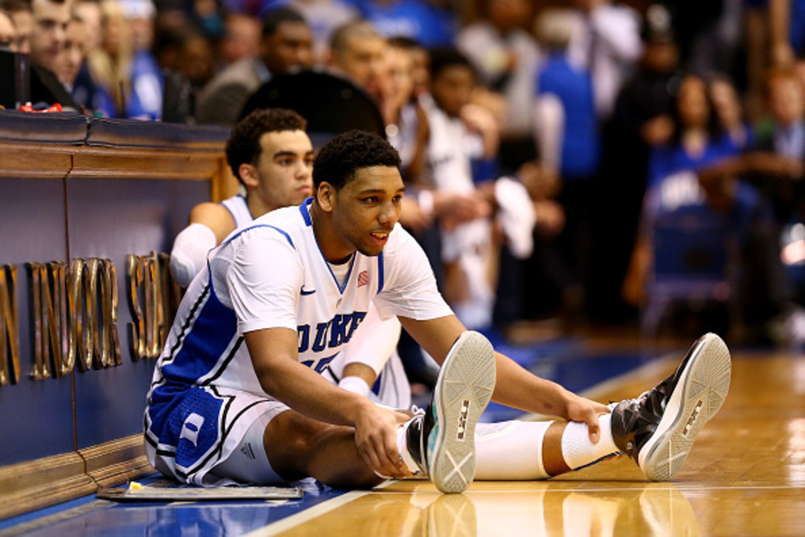 DURHAM, NC - DECEMBER 15:  Teammates Jahlil Okafor #15 and Tyus Jones #5 of the Duke Blue Devils wait to go into the game against the Elon Phoenix at Cameron Indoor Stadium on December 15, 2014 in Durham, North Carolina.  (Photo by Streeter Lecka/Getty Im