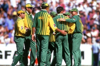 MELBOURNE, AUSTRALIA - DECEMBER 13:  Australia A players celebrate after taking a wicket during the Benson & Hedges World Series match between Australia A and England at the Melbourne Cricket Ground December 13, 1994 in Melbourne, Australia. England won b