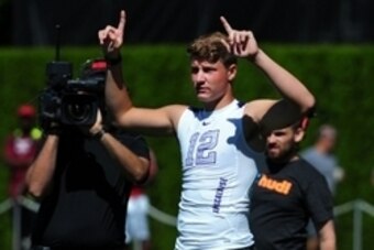 Jul 10, 2014; Beaverton, OR, USA; Apocalypse quarterback Blake Barnett (12) signals to the sidelines during Nike Football ' The Opening' at Nike World Headquarters.  Mandatory Credit: Steve Dykes-USA TODAY Sports