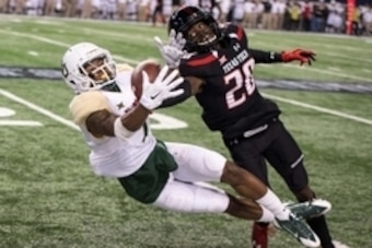 Nov 29, 2014; Arlington, TX, USA; Texas Tech Red Raiders defensive back Tevin Madison (20) breaks up a pass intended for Baylor Bears running back Corey Coleman (1) during the second half at AT&T Stadium. The Bears defeated the Red Raiders 48-46. Mandator