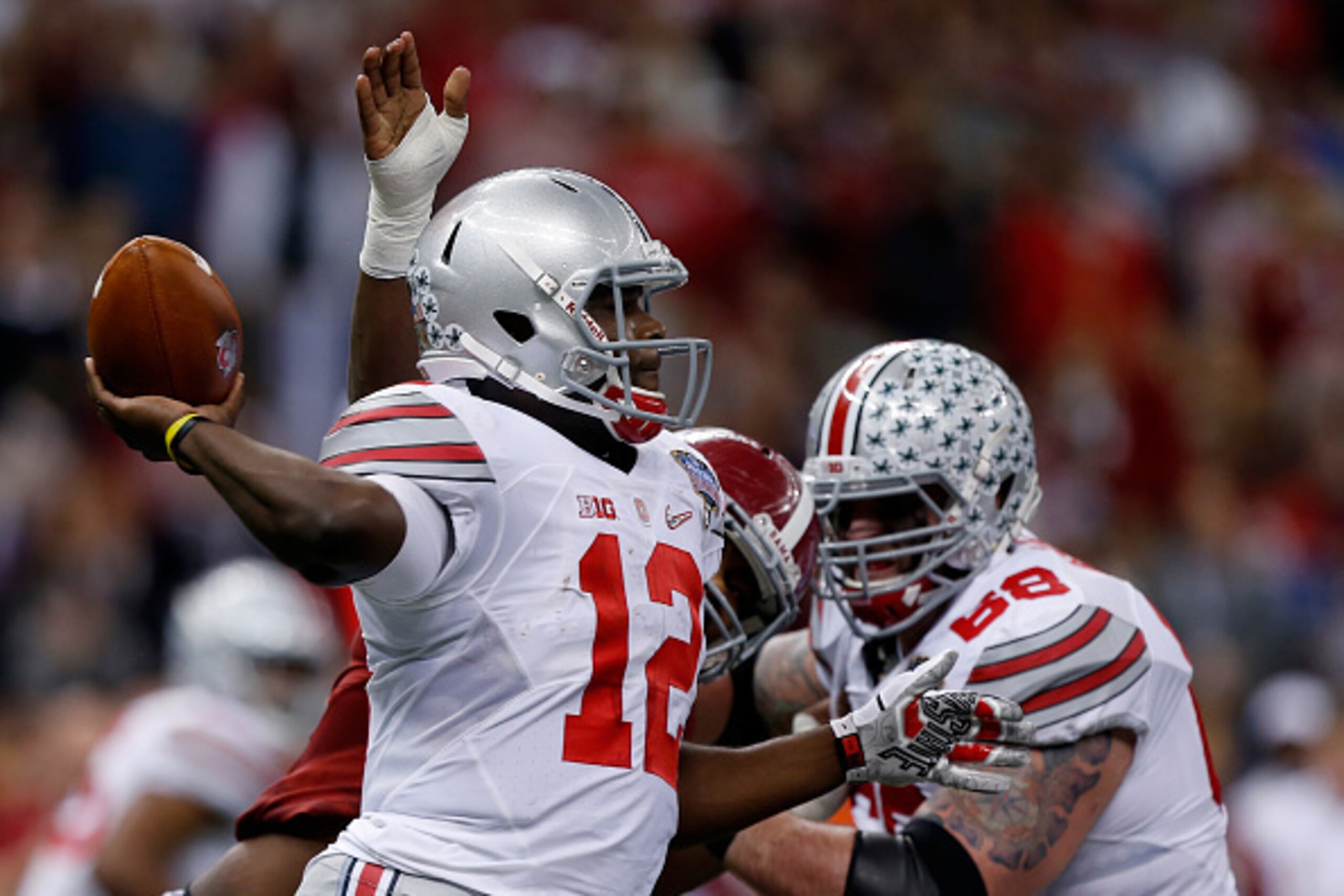 NEW ORLEANS, LA - JANUARY 01:  Cardale Jones #12 of the Ohio State Buckeyes in action against the Alabama Crimson Tide during the All State Sugar Bowl at the Mercedes-Benz Superdome on January 1, 2015 in New Orleans, Louisiana.  (Photo by Sean Gardner/Get