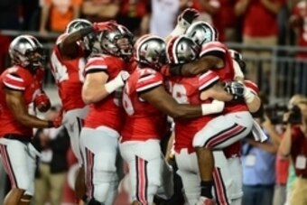 Sep 6, 2014; Columbus, OH, USA; Ohio State Buckeyes players celebrate a touchdown during the fourth quarter against the Virginia Tech Hokies at Ohio Stadium. Mandatory Credit: Andrew Weber-USA TODAY Sports