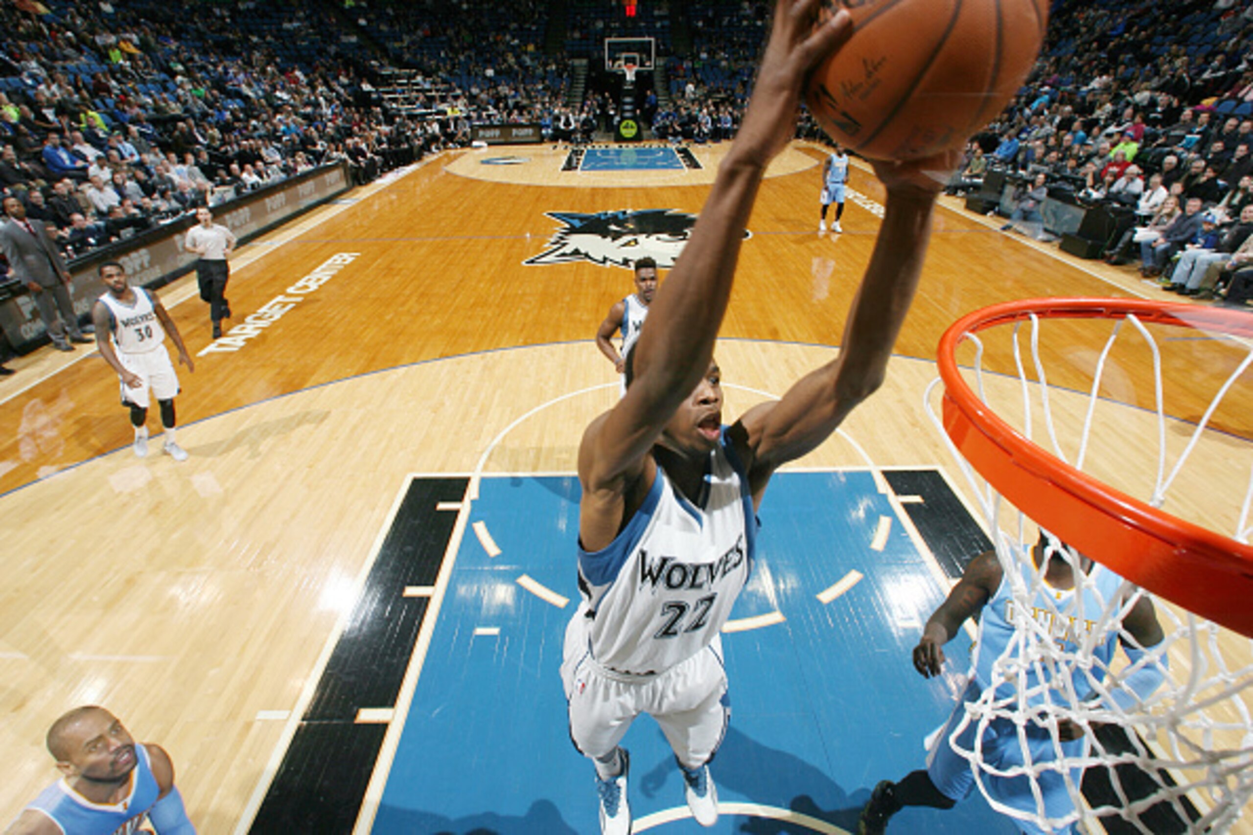 MINNEAPOLIS, MN -  JANUARY 5: Andrew Wiggins #22 of the Minnesota Timberwolves goes for the dunk against the Denver Nuggets during the game on January 5, 2015 at Target Center in Minneapolis, Minnesota. NOTE TO USER: User expressly acknowledges and agrees