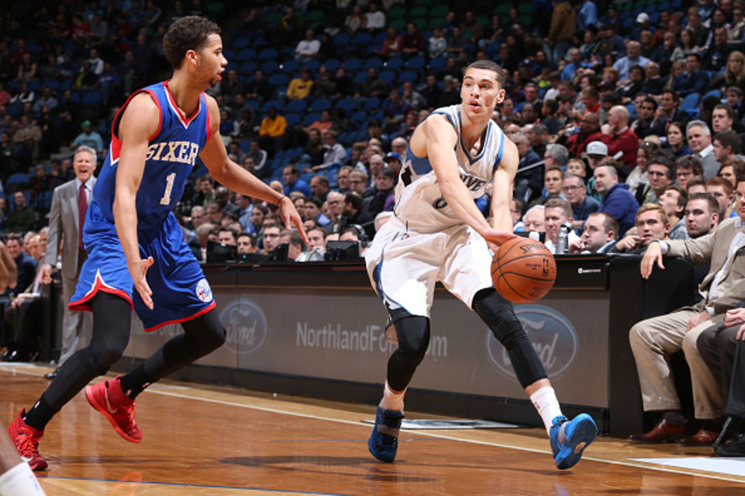 MINNEAPOLIS, MN - December 3: Zach LaVine #8 of the Minnesota Timberwolves passes the ball against Michael Carter-Williams #1 of the Philadelphia 76ers during the game on December 3, 2014 at Target Center in Minneapolis, Minnesota. NOTE TO USER: User expr
