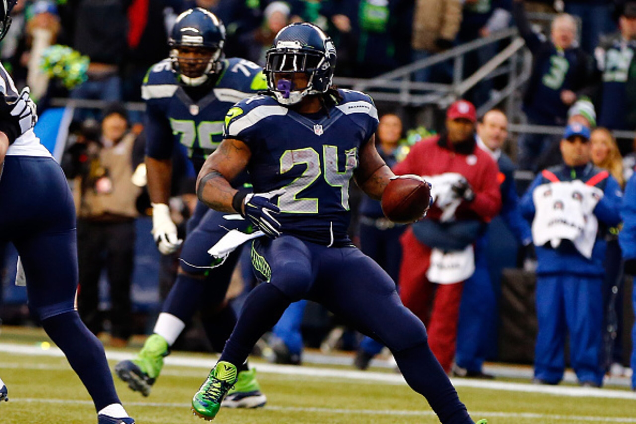 SEATTLE, WA - DECEMBER 28: Running back Marshawn Lynch #24 of the Seattle Seahawks runs into the end zone for a touchdown during the fourth quarter of the game against the St. Louis Rams at CenturyLink Field on December 28, 2014 in Seattle, Washington.  (