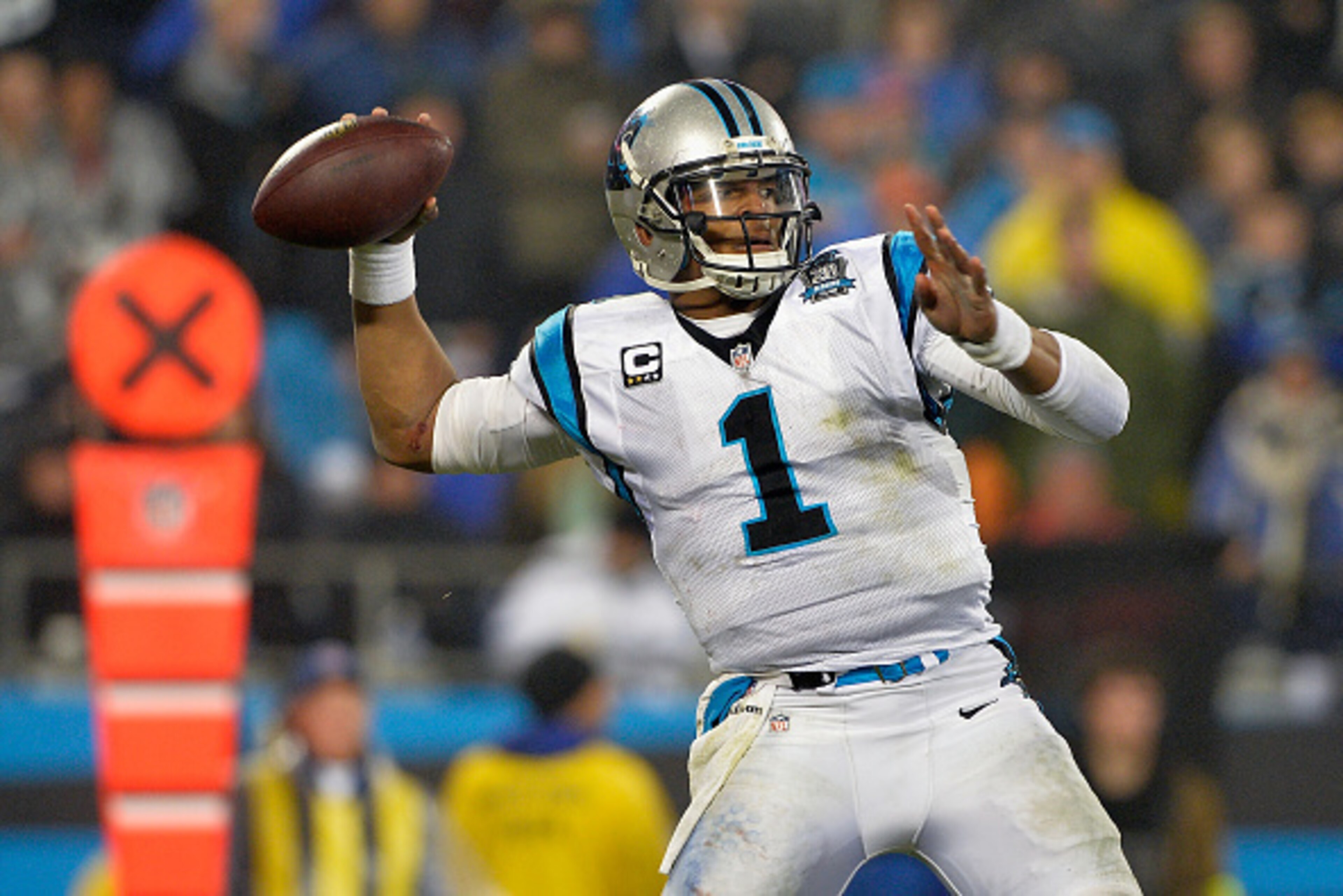 CHARLOTTE, NC - JANUARY 03:  Cam Newton #1 of the Carolina Panthers throws a pass against the Arizona Cardinals in the 3rd quarter during their NFC Wild Card Playoff game at Bank of America Stadium on January 3, 2015 in Charlotte, North Carolina.  (Photo 