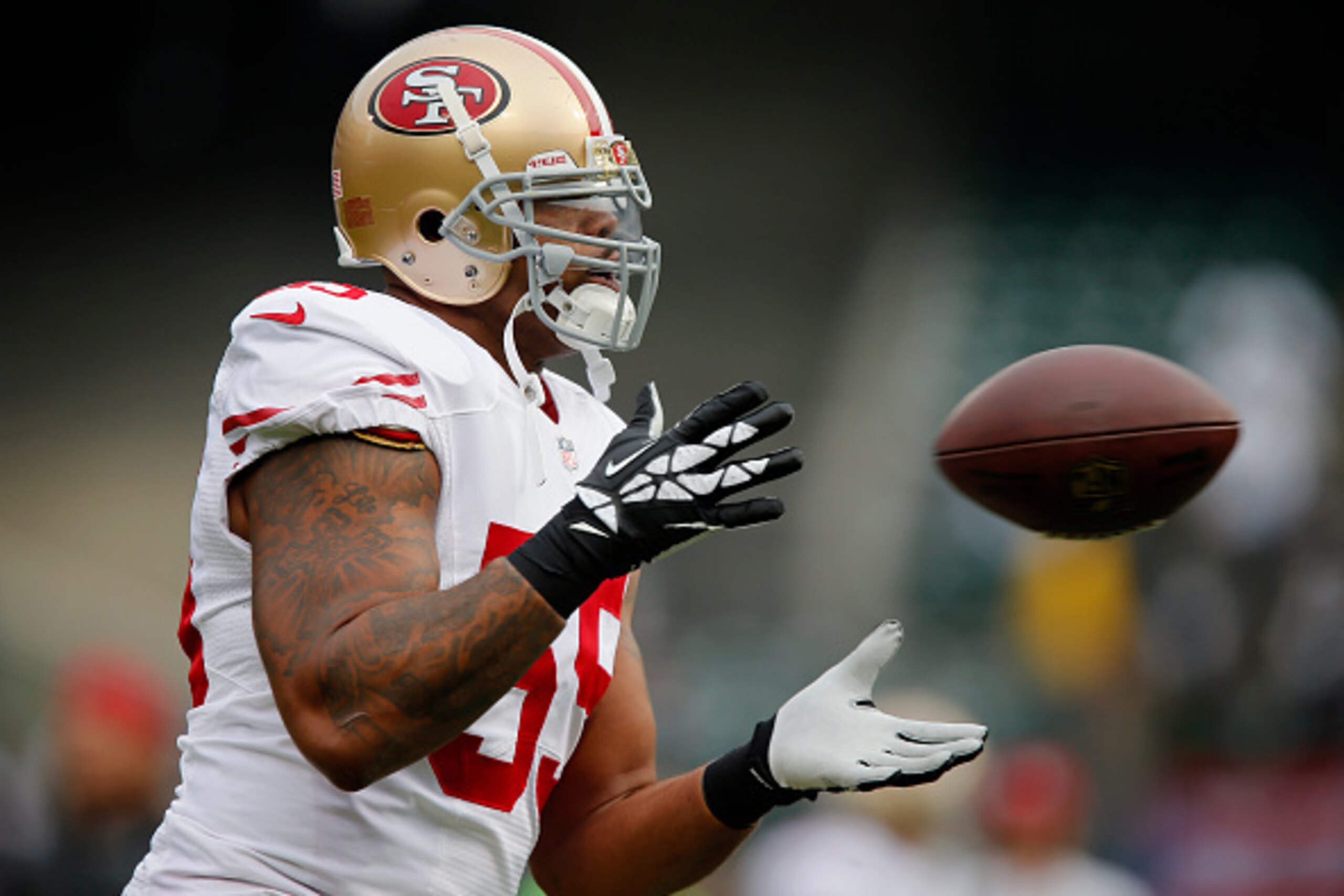 OAKLAND, CA - DECEMBER 7:  Linebacker Ahmad Brooks #55 of the San Francisco 49ers catches a pass against the Oakland Raiders on December 7, 2014 at O.co Coliseum in Oakland, California.  The Raiders won 24-13.  (Photo by Brian Bahr/Getty Images)