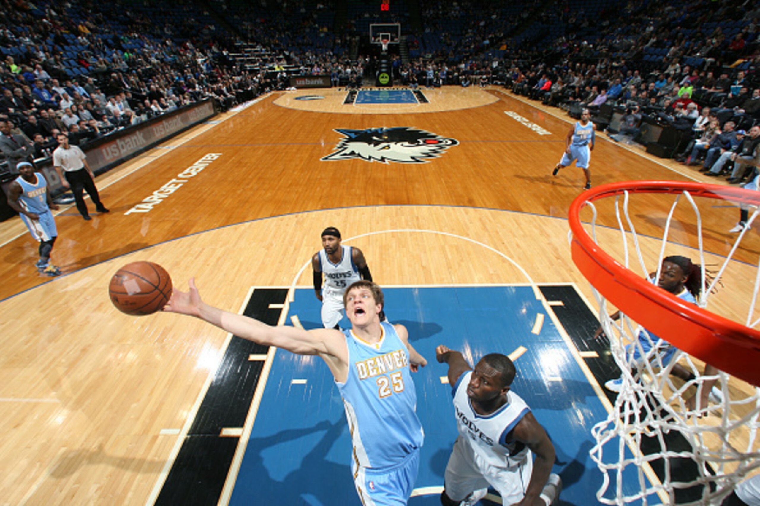 MINNEAPOLIS, MN -  JANUARY 5: Timofey Mozgov #25 of the Denver Nuggets reaches for the rebound against the Minnesota Timberwolves during the game on January 5, 2015 at Target Center in Minneapolis, Minnesota. NOTE TO USER: User expressly acknowledges and 