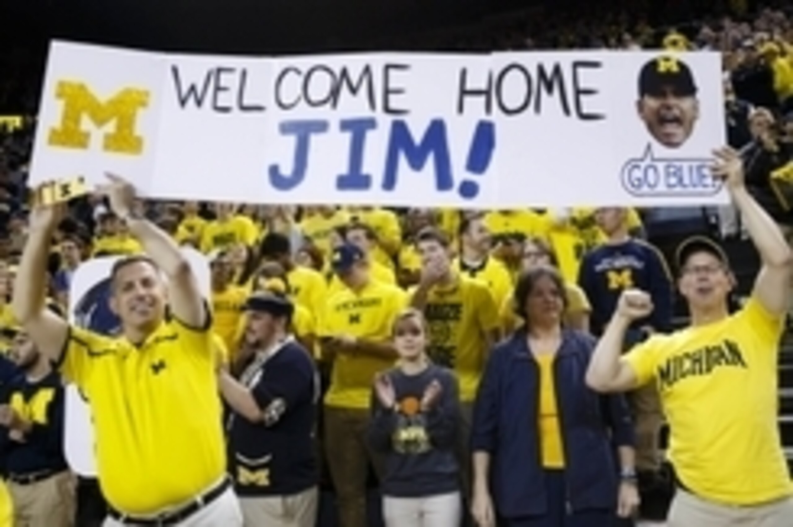 Dec 30, 2014; Ann Arbor, MI, USA; Fans hold up a sign for new Michigan Wolverines head football coach Jim Harbaugh during halftime of the basketball game against the Illinois Fighting Illini at Crisler Center. Mandatory Credit: Rick Osentoski-USA TODAY Sp