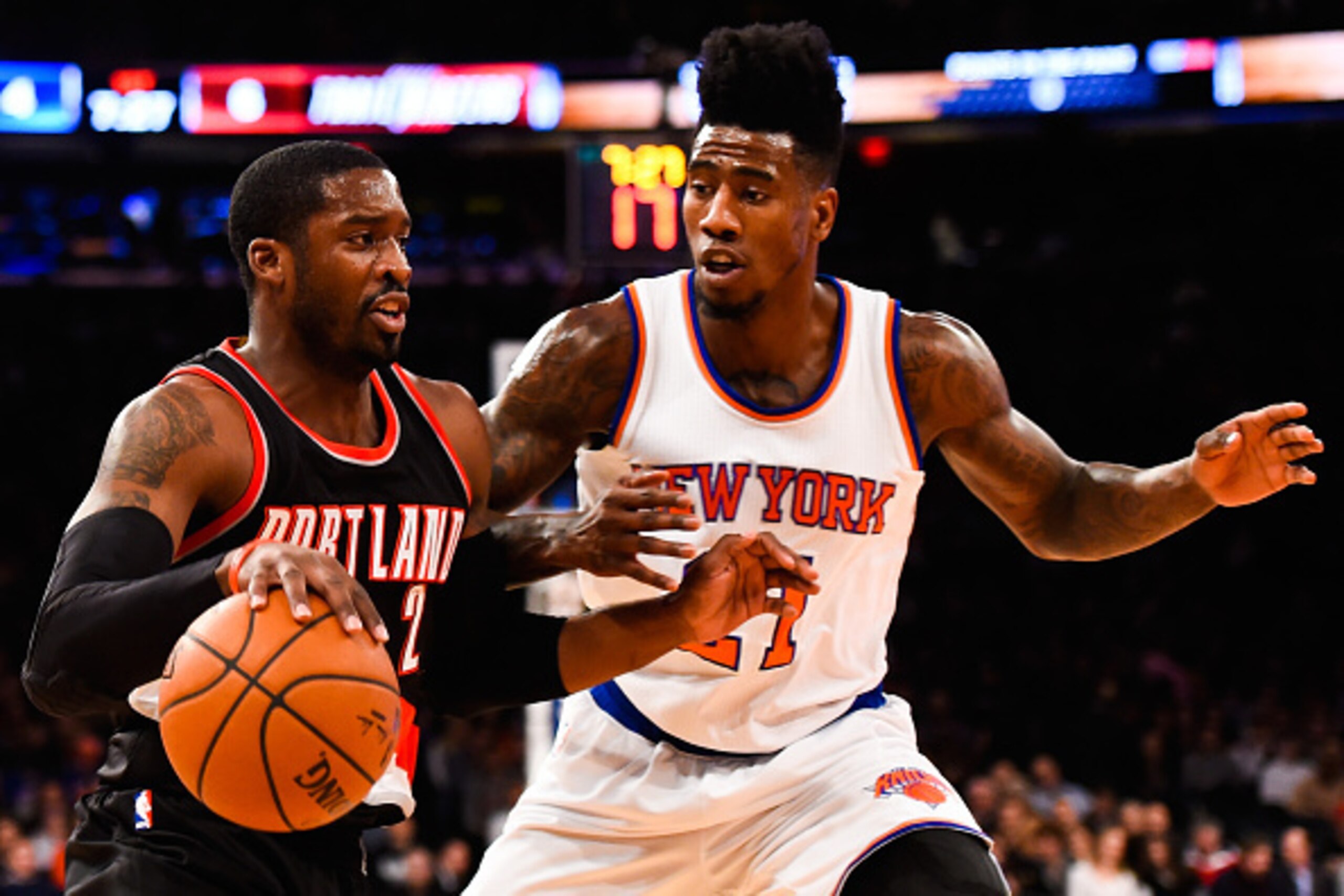 NEW YORK, NY - DECEMBER 07: Wesley Matthews #2 of the Portland Trail Blazers attempts to dribble past Iman Shumpert #21 of the New York Knicks in the first half at Madison Square Garden on December 7, 2014 in New York City. NOTE TO USER: User expressly ac