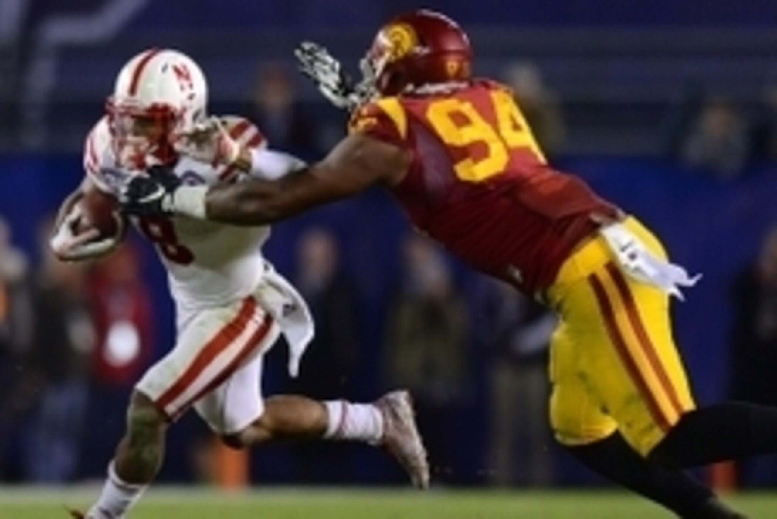 Dec 27, 2014; San Diego, CA, USA; Nebraska Cornhuskers running back Ameer Abdullah (8) runs as USC Trojans defensive end Leonard Williams (94) defends during the fourth quarter in the 2014 Holiday Bowl at Qualcomm Stadium. Mandatory Credit: Jake Roth-USA 