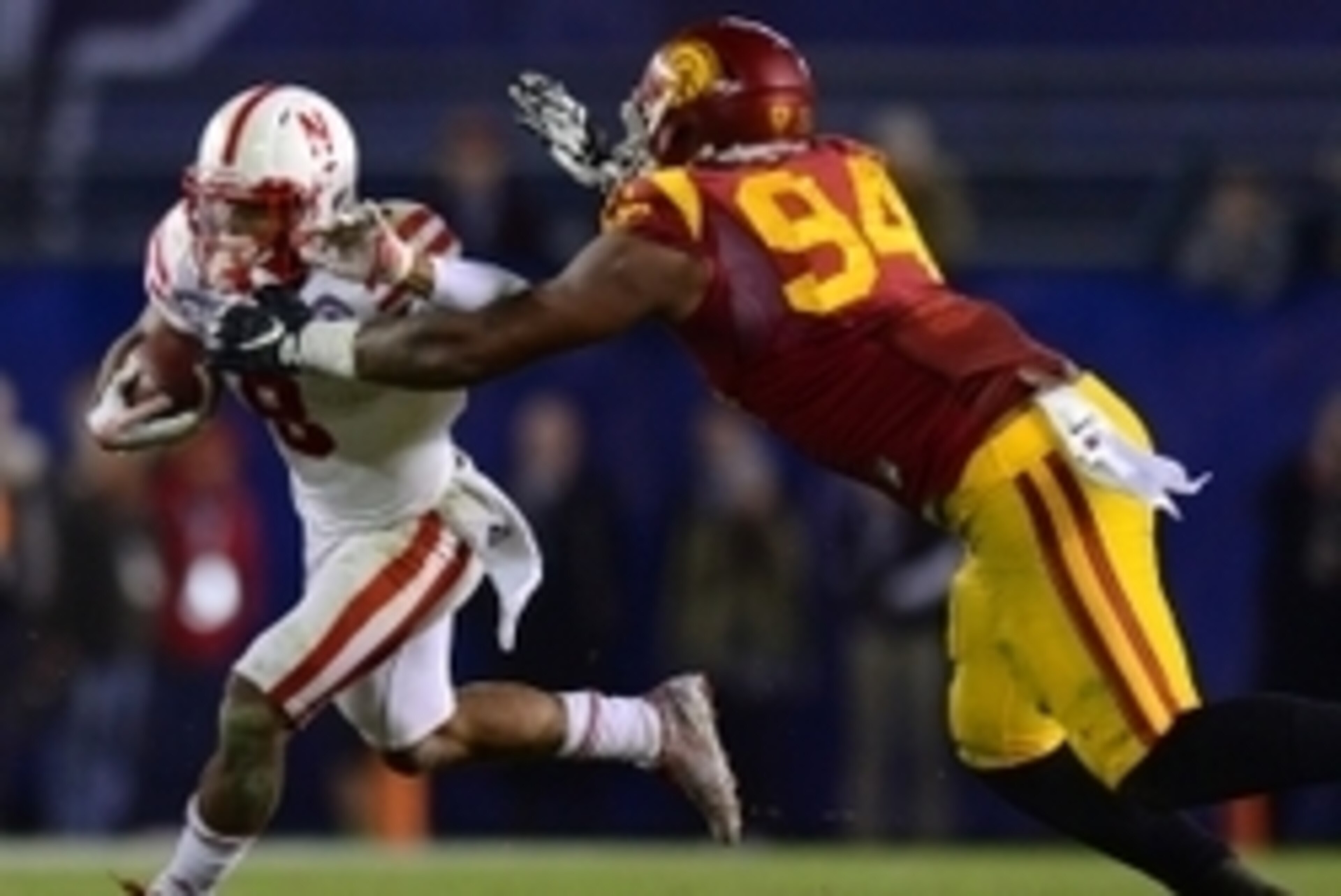 Dec 27, 2014; San Diego, CA, USA; Nebraska Cornhuskers running back Ameer Abdullah (8) runs as USC Trojans defensive end Leonard Williams (94) defends during the fourth quarter in the 2014 Holiday Bowl at Qualcomm Stadium. Mandatory Credit: Jake Roth-USA 