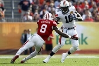 Jan 1, 2015; Tampa, FL, USA; Auburn Tigers wide receiver Sammie Coates (18) runs with the ball as Wisconsin Badgers cornerback Sojourn Shelton (8) defends during the second half in the 2015 Outback Bowl at Raymond James Stadium. Wisconsin Badgers defeated