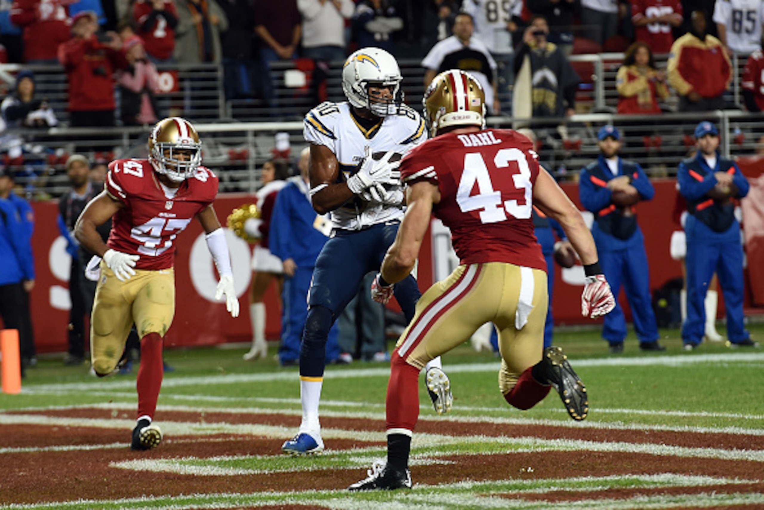 SANTA CLARA, CA - DECEMBER 20:  Malcom Floyd #80 of the San Diego Chargers completes an 11 yard pass in the middle of Craig Dahl #43 and Marcus Cromartie #47 of the San Francisco 49ers to tie the game in the fourth quarter at Levi's Stadium on December 20