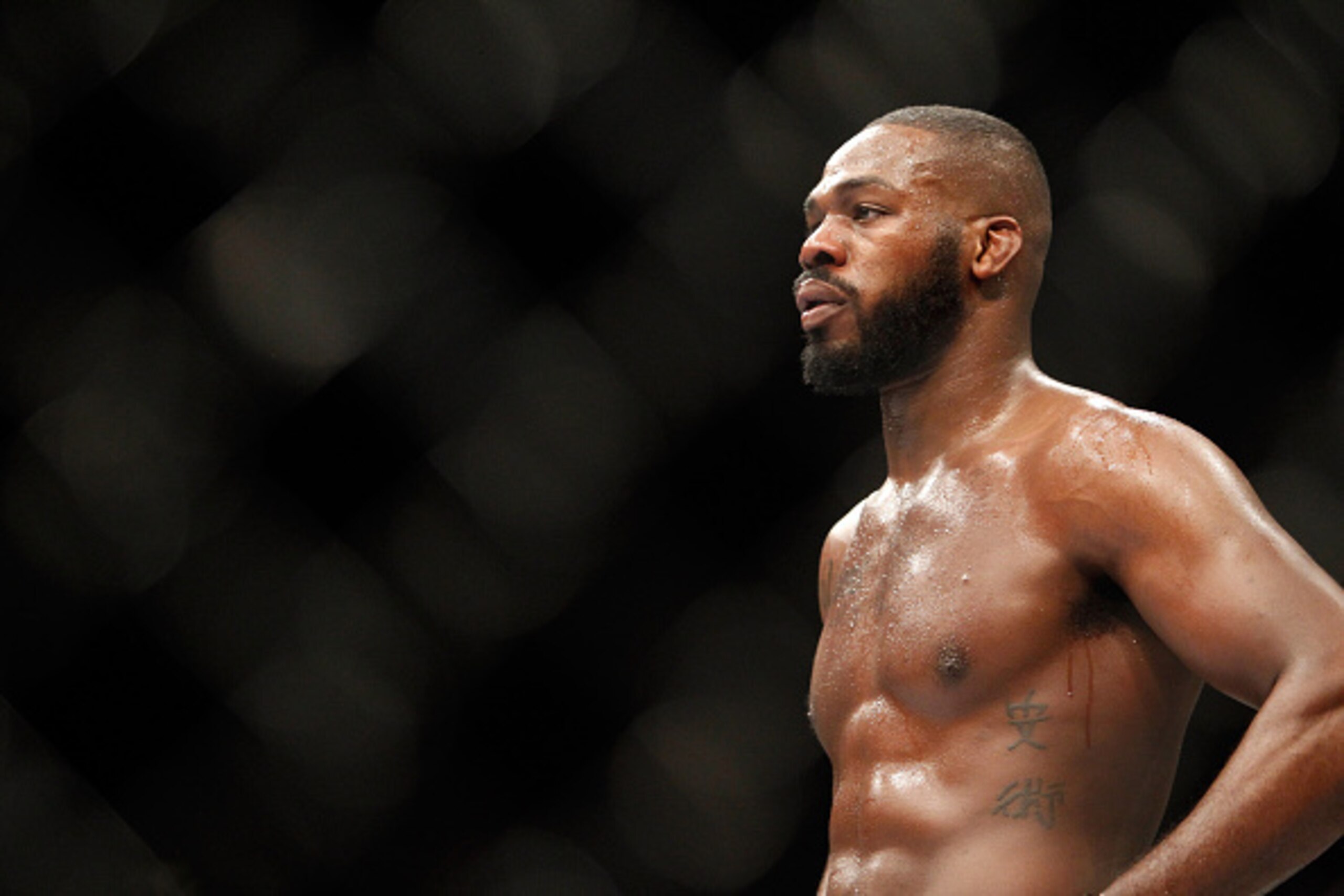 LAS VEGAS, NV - JANUARY 03:  Light heavyweight champion Jon Jones waits in a time-out as he defends his title against Daniel Cormier during the UFC 182 event  at the MGM Grand Garden Arena on January 3, 2015 in Las Vegas, Nevada. Jones retained his title 