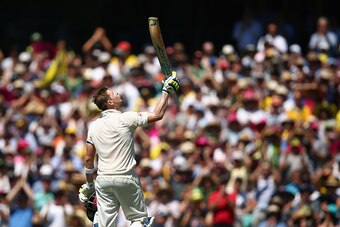 SYDNEY, AUSTRALIA - JANUARY 07:  Australian captain Steve Smith looks to the sky and celebrates after scoring a century during day two of the Fourth Test match between Australia and India at Sydney Cricket Ground on January 7, 2015 in Sydney, Australia.  