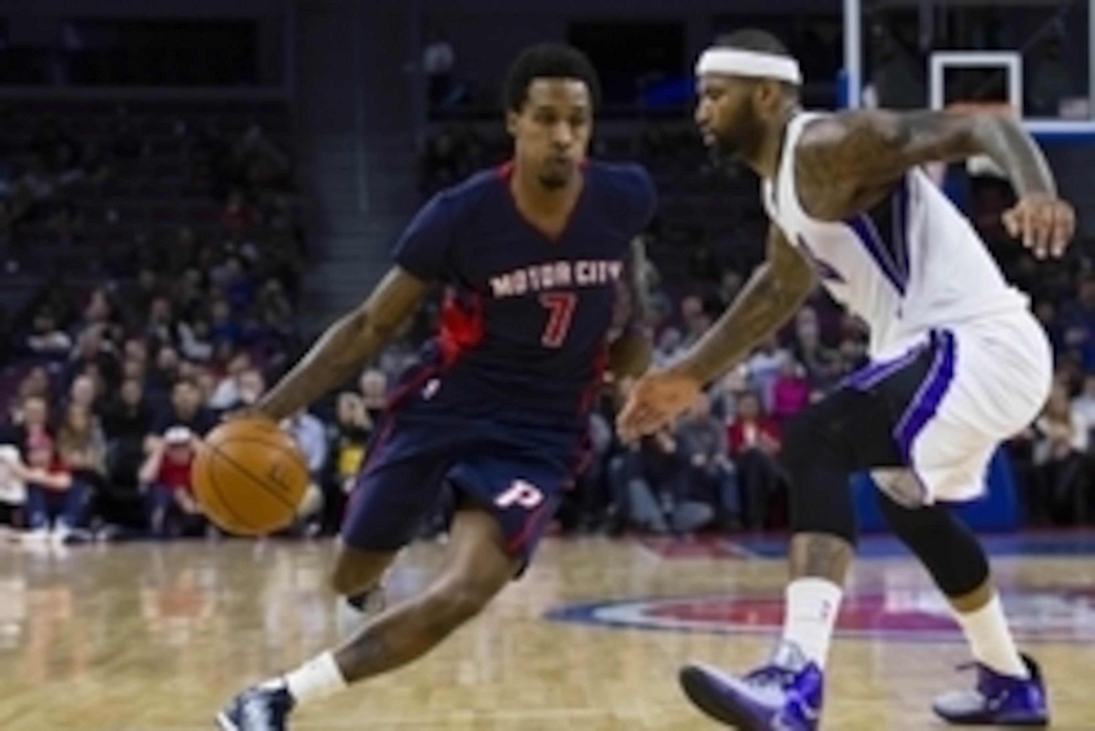 Jan 4, 2015; Auburn Hills, MI, USA; Detroit Pistons guard Brandon Jennings (7) moves the ball on Sacramento Kings center DeMarcus Cousins (15) in the fourth quarter at The Palace of Auburn Hills. Detroit won 114-95. Mandatory Credit: Rick Osentoski-USA TO