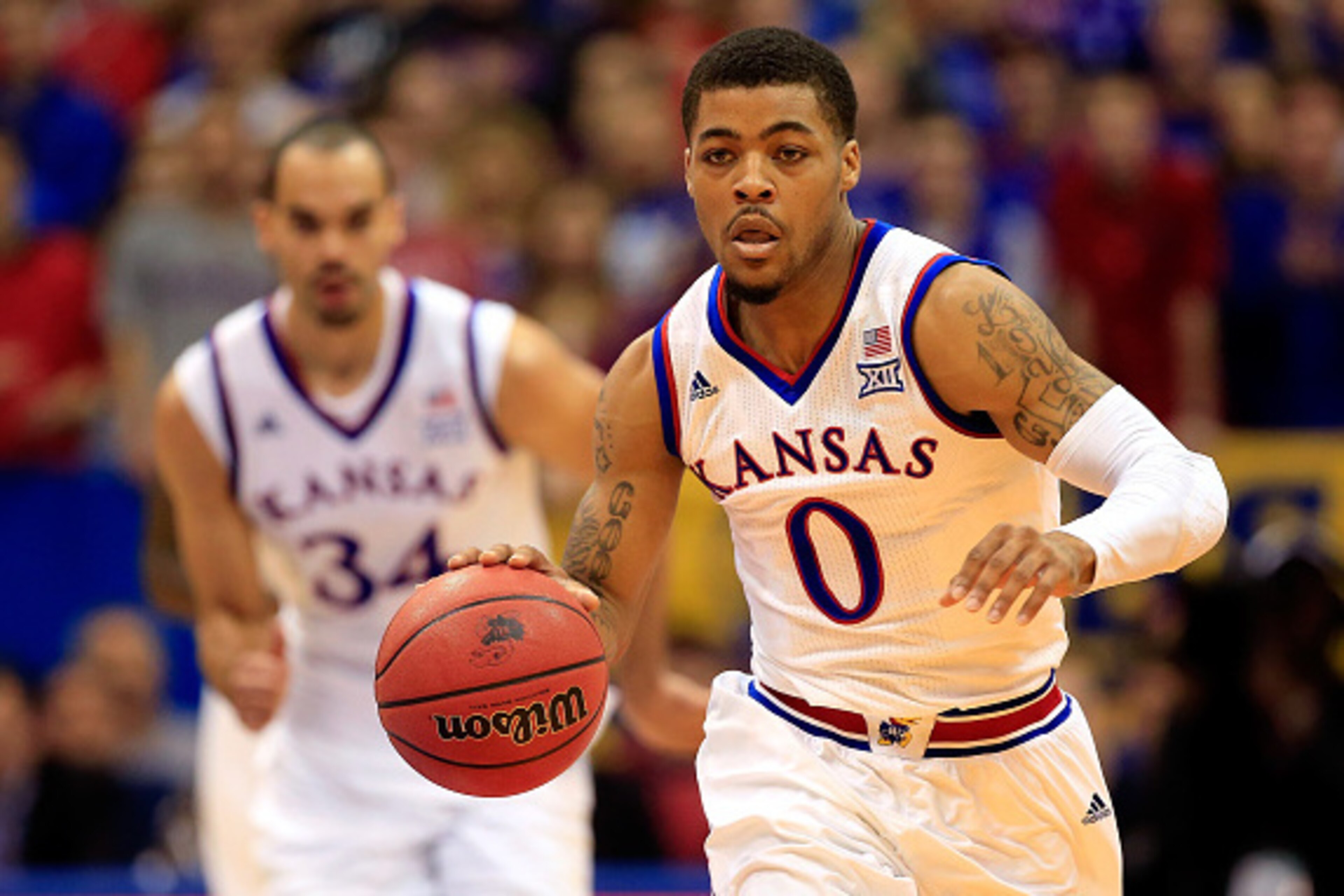 LAWRENCE, KS - JANUARY 04:  Frank Mason III #0 of the Kansas Jayhawks controls the ball during the game against the UNLV Rebels at Allen Fieldhouse on January 4, 2015 in Lawrence, Kansas.  (Photo by Jamie Squire/Getty Images)