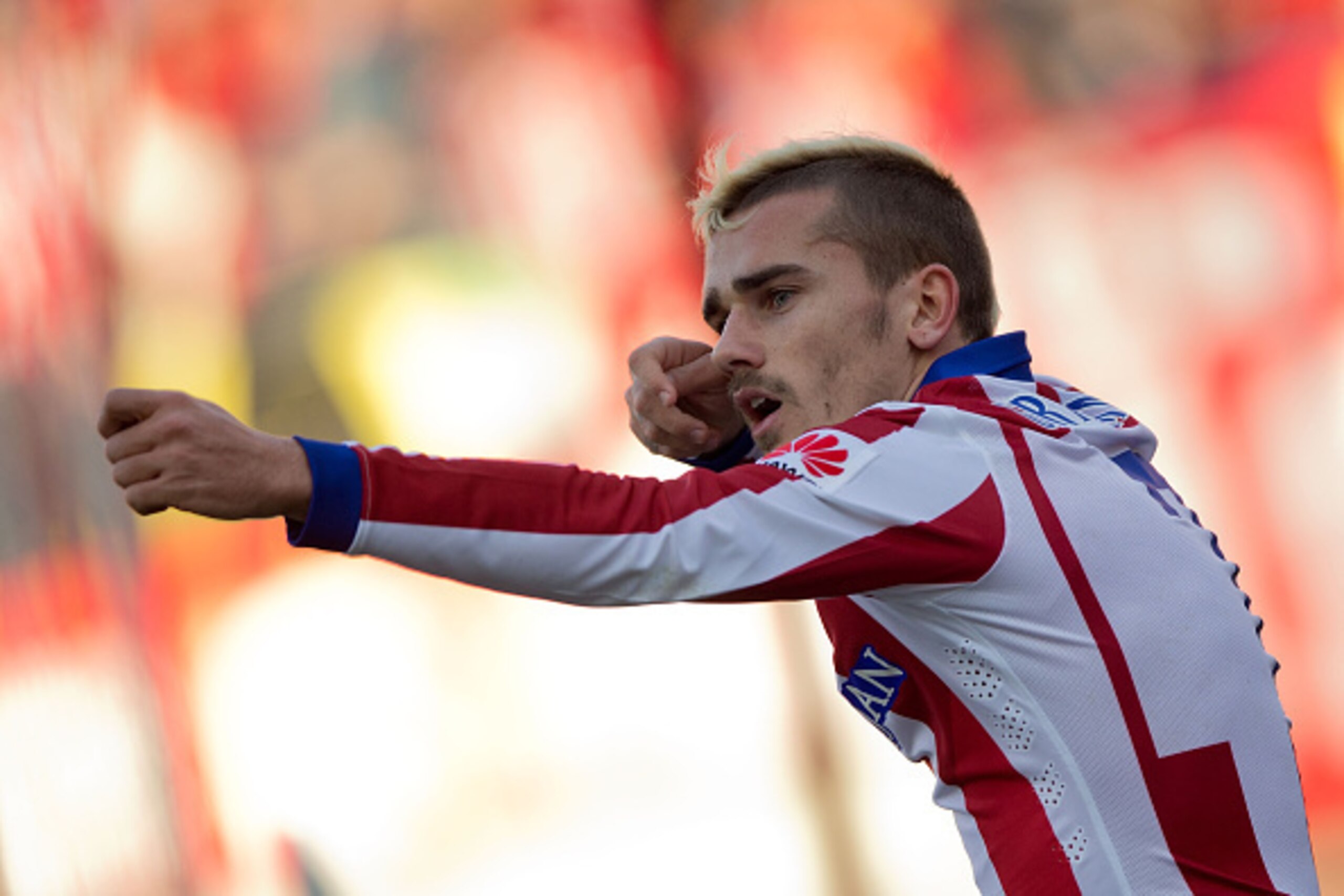 MADRID, SPAIN - JANUARY 03: Antoine Griezmann of Atletico de Madrid celebrates scoring their opening goal during the La Liga match between Club Atletico de Madrid and Levante UD at Vicente Calderon Stadium on January 3, 2015 in Madrid, Spain. (Photo by G MADRID, SPAIN - JANUARY 03: Antoine Griezmann of Atletico de Madrid celebrates scoring their opening goal during the La Liga match between Club Atletico de Madrid and Levante UD at Vicente Calderon Stadium on January 3, 2015 in Madrid, Spain. (Photo by G