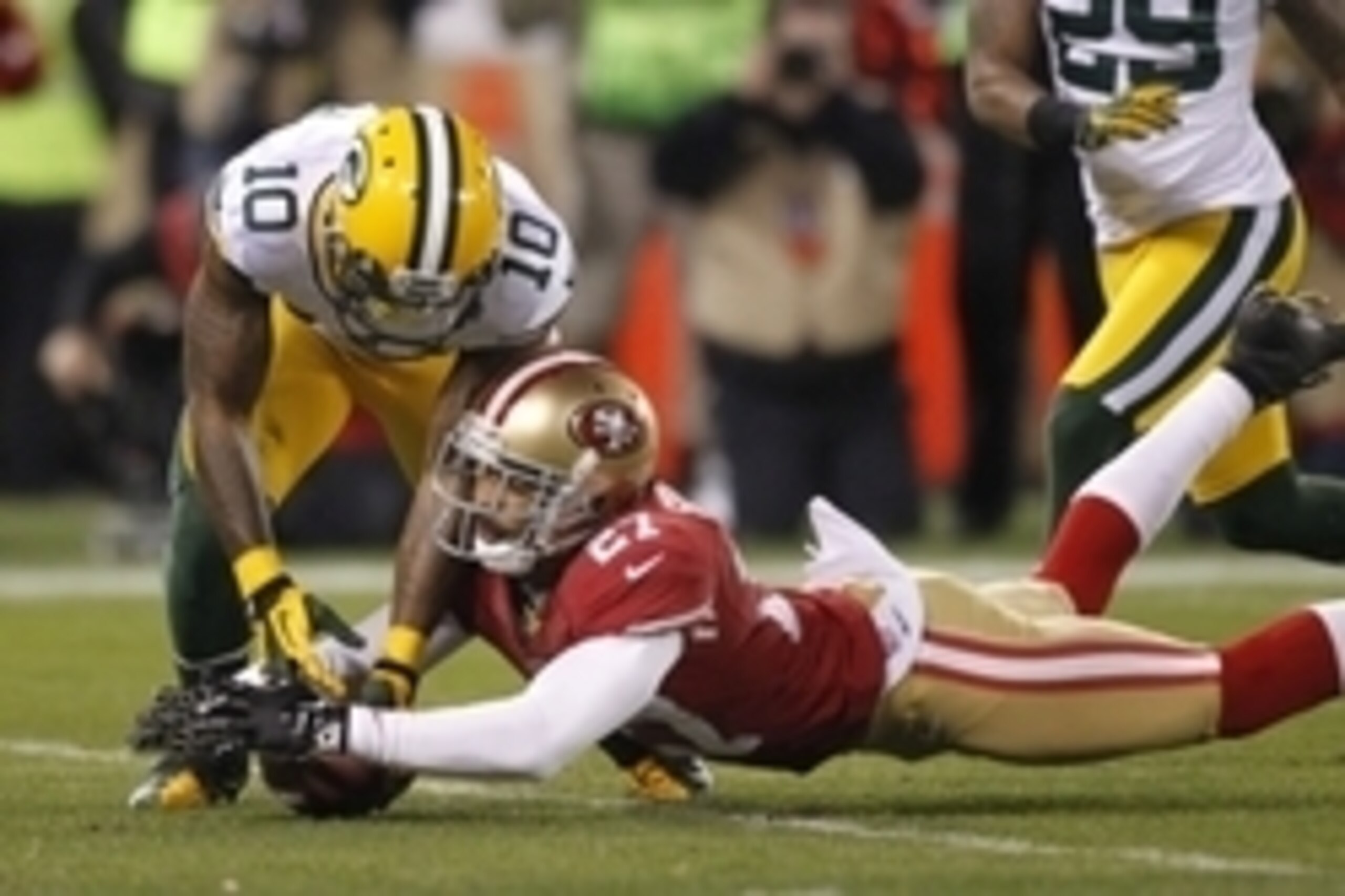 Jan 12, 2013; San Francisco, CA, USA; San Francisco 49ers safety C.J. Spillman (27) dives for the ball after a dropped punt catch by Green Bay Packers wide receiver Jeremy Ross (10) during the second quarter of the NFC divisional round playoff game at Can