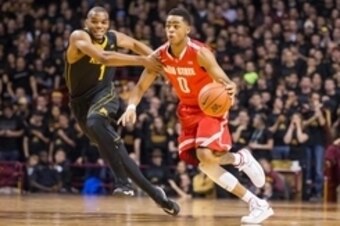 Jan 6, 2015; Minneapolis, MN, USA; Ohio State Buckeyes guard D'Angelo Russell (0) dribbles around Minnesota Golden Gophers guard Andre Hollins (1) in the first half at Williams Arena. Mandatory Credit: Jesse Johnson-USA TODAY Sports