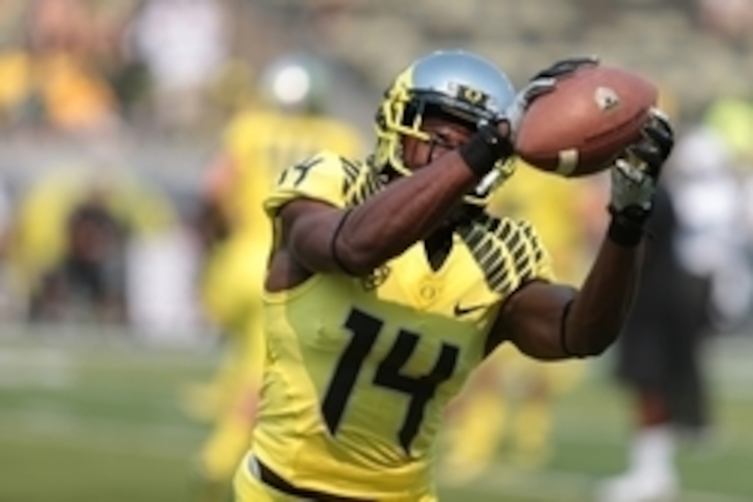 Sep 6, 2014; Eugene, OR, USA; Oregon Ducks defensive back Ifo Ekpre-Olomu (14) catches the ball before the game against the Michigan State Spartans at Autzen Stadium. Mandatory Credit: Scott Olmos-USA TODAY Sports
