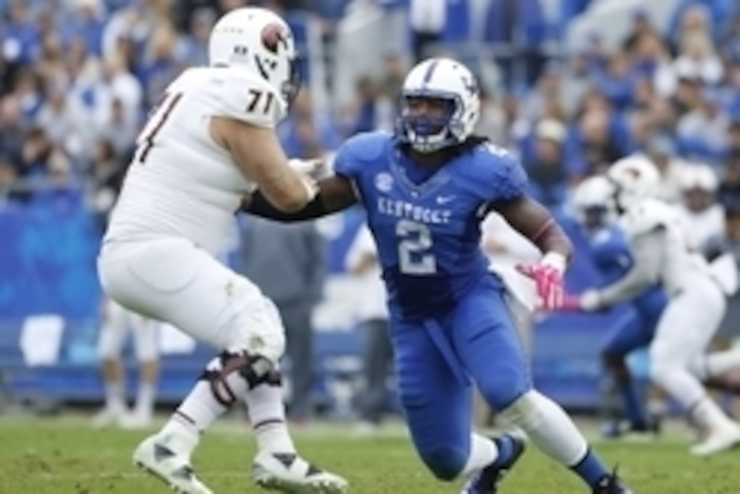 Oct 11, 2014; Lexington, KY, USA; Louisiana-Monroe Warhawks offensive lineman Chase Regian (71) and Kentucky Wildcats defensive end Alvin Dupree (2) during the game at Commonwealth Stadium. Kentucky defeated Louisiana-Monroe 48-14. Mandatory Credit: Mark 