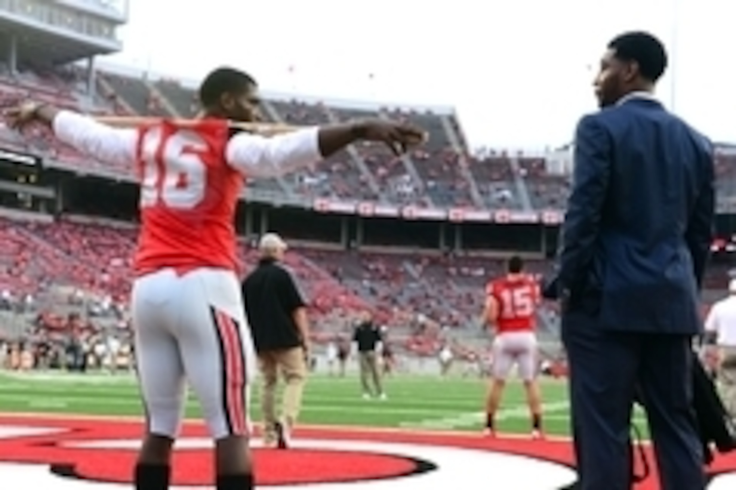 Sep 6, 2014; Columbus, OH, USA; Ohio State Buckeyes quarterback J.T. Barrett (16) talks with Braxton Miller on the field prior to the game against the Virginia Tech Hokies at Ohio Stadium. Mandatory Credit: Andrew Weber-USA TODAY Sports