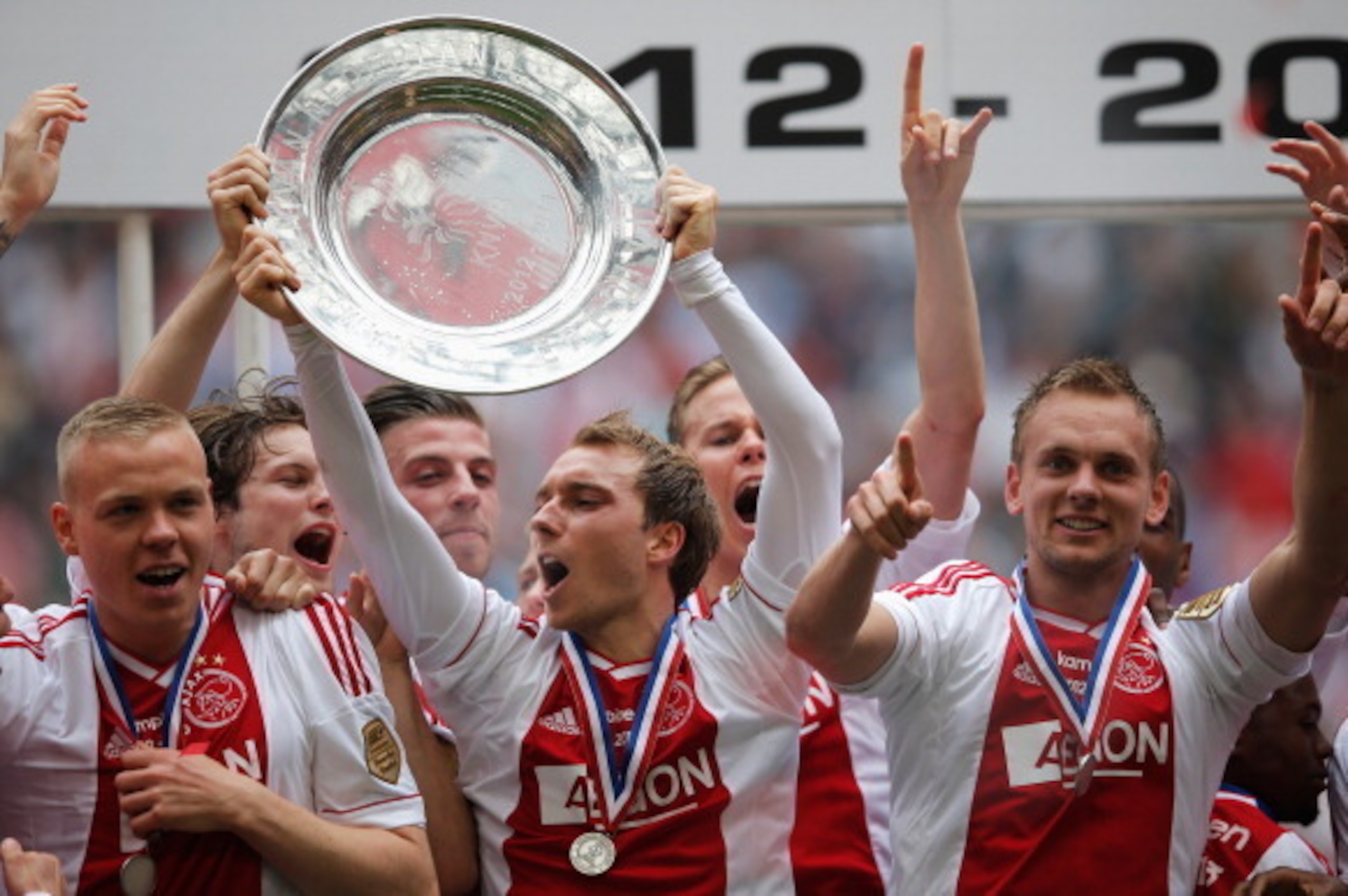AMSTERDAM, NETHERLANDS - MAY 05: (L-R) Ajax players, Kolbeinn Sigthorsson, Christian Eriksen and captain, Siem De Jong lead celebrations with the Eredivisie Championship trophy after the match between Ajax and Willem II Tilburg at Amsterdam Arena on May AMSTERDAM, NETHERLANDS - MAY 05: (L-R) Ajax players, Kolbeinn Sigthorsson, Christian Eriksen and captain, Siem De Jong lead celebrations with the Eredivisie Championship trophy after the match between Ajax and Willem II Tilburg at Amsterdam Arena on May