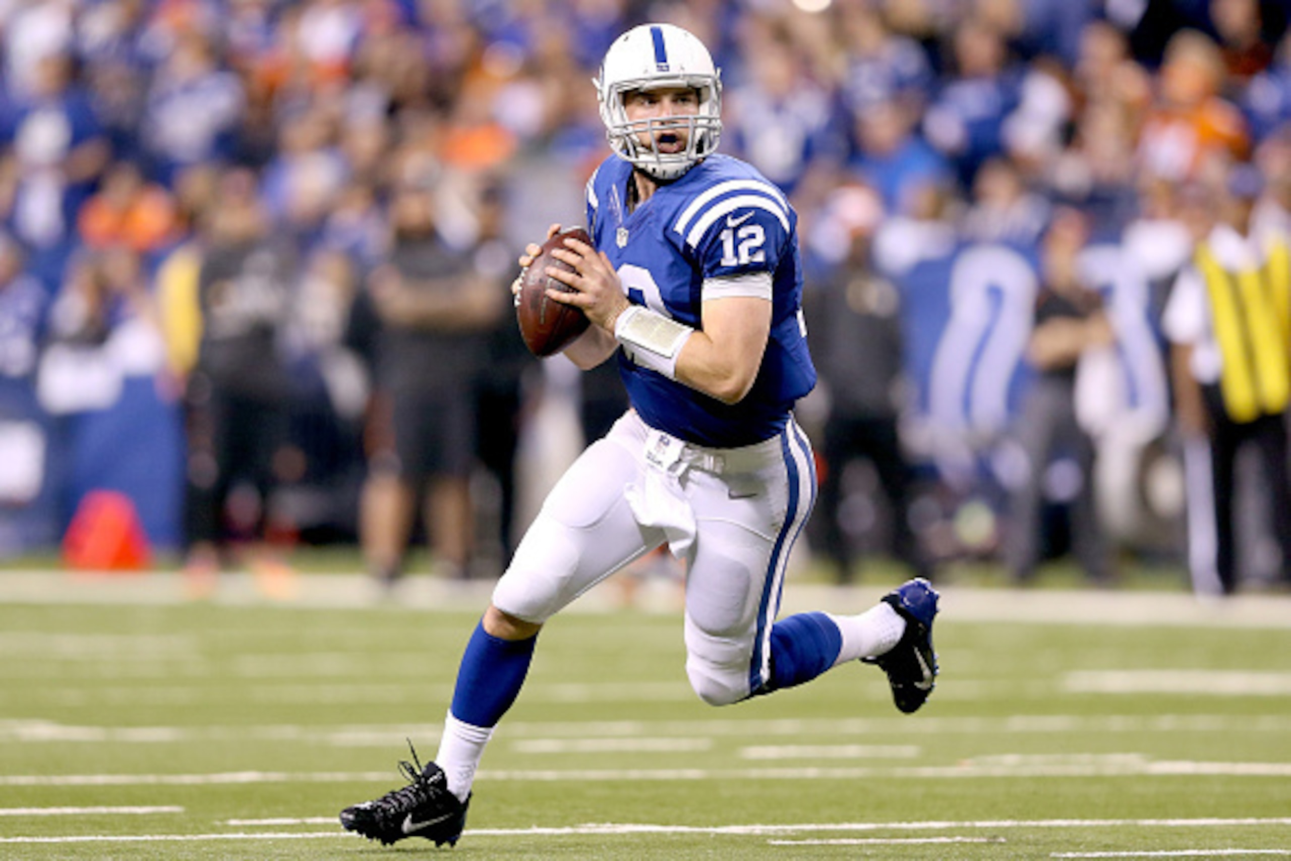INDIANAPOLIS, IN - JANUARY 04:  Quarterback Andrew Luck #12 of the Indianapolis Colts looks to throw against the Cincinnati Bengals in the second half during their AFC Wild Card game at Lucas Oil Stadium on January 4, 2015 in Indianapolis, Indiana.  (Phot