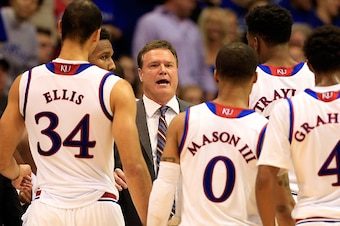 LAWRENCE, KS - DECEMBER 05:  Head coach Bill Self of the Kansas Jayhawks talks with players during a timeout in the game against the Florida Gators at Allen Fieldhouse on December 5, 2014 in Lawrence, Kansas.  (Photo by Jamie Squire/Getty Images)