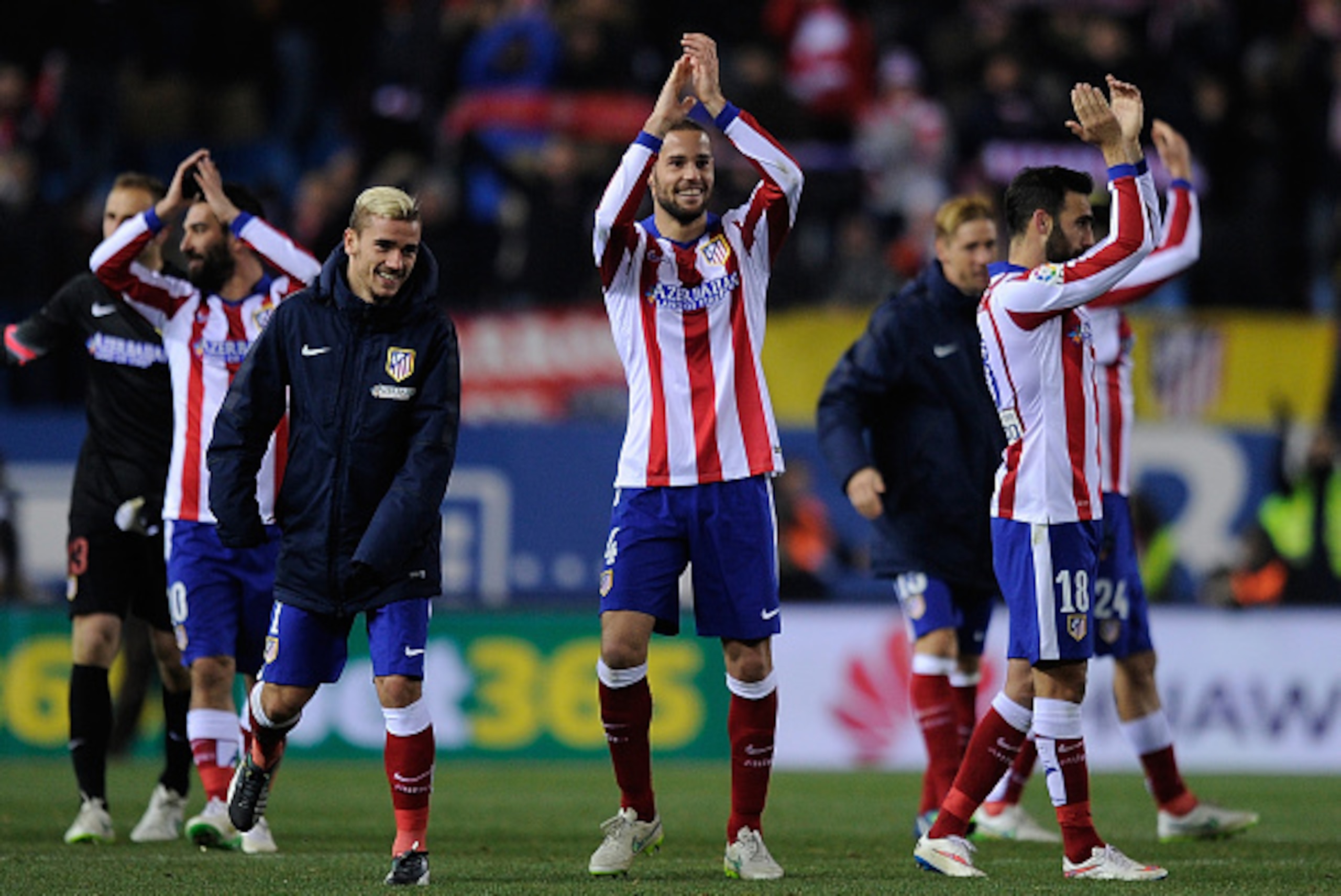MADRID, SPAIN - JANUARY 07: Mario Suarez of Club Atletico de Madrid celebrates with Antoine Griezmann after their team beat Real Madrid  2-0 during the Copa del Rey Round of 16, First Leg match between Club Atletico de Madrid and Real Madrid at Vicente Ca