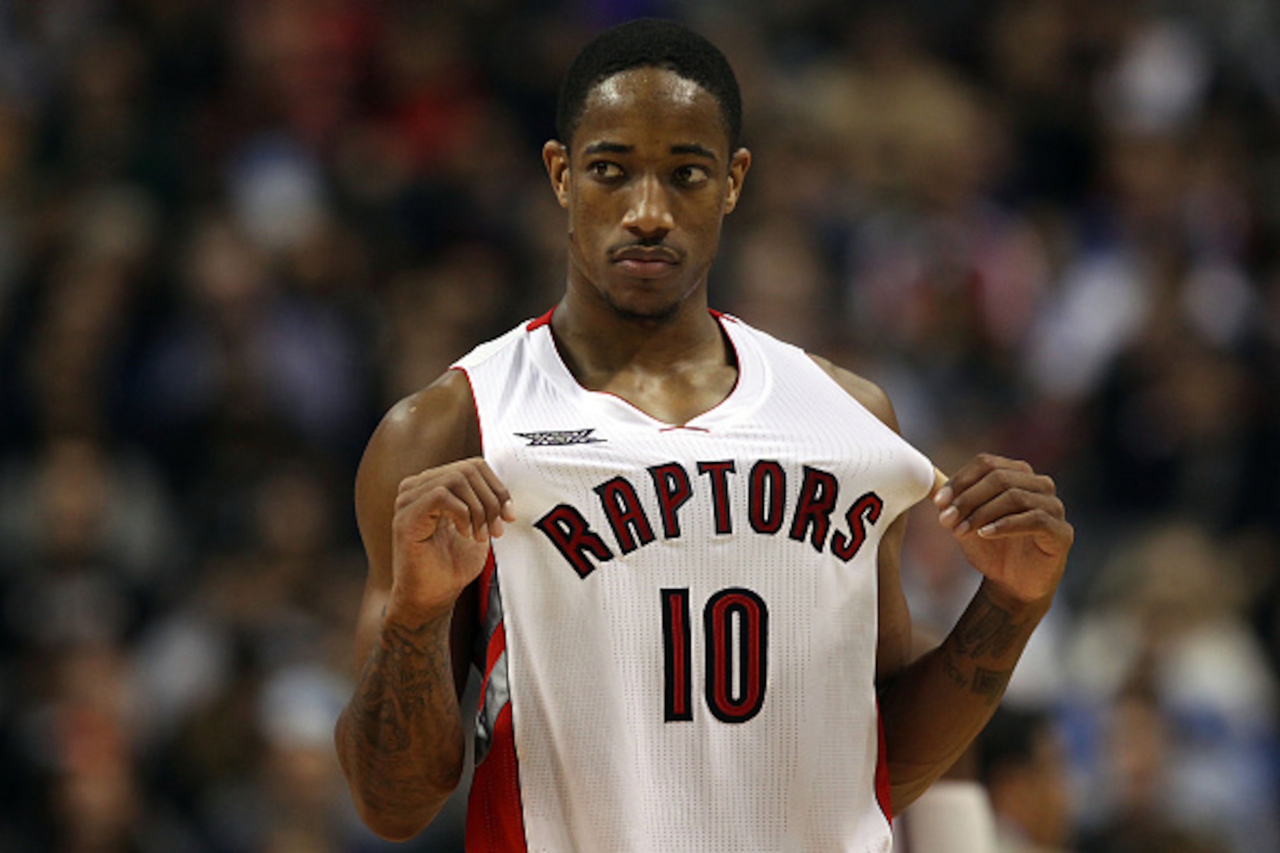 TORONTO, ON - NOVEMBER 4:  DeMar DeRozan #10 of the Toronto Raptors looks on as his team faces the Oklahoma City Thunder during their game at Air Canada Centre on November 4, 2014 in Toronto, Canada. NOTE TO USER: User expressly acknowledges and agrees th