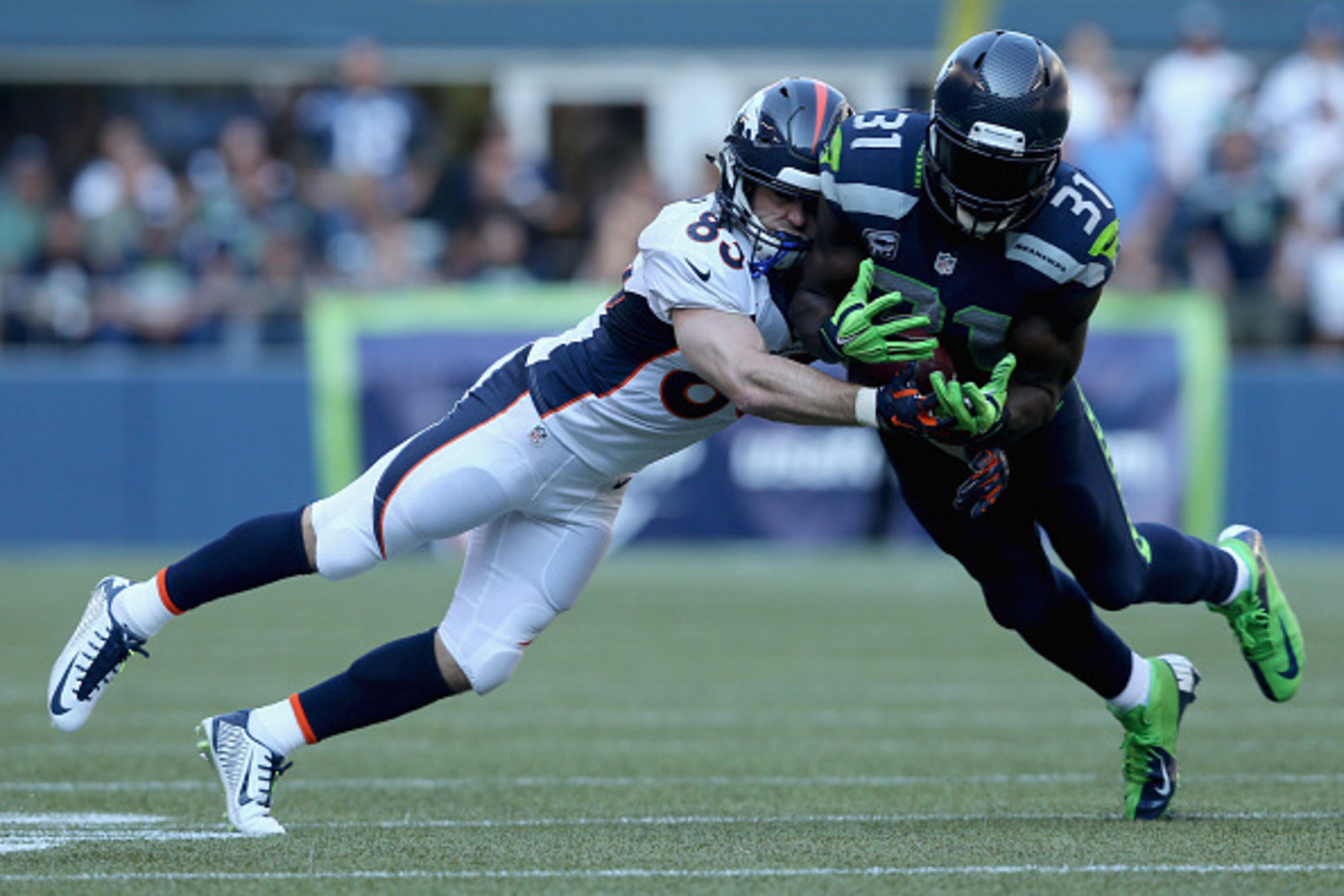 SEATTLE, WA - SEPTEMBER 21:  Strong safety Kam Chancellor #31 of the Seattle Seahawks breaks up a pass intended for wide receiver Wes Welker #83 of the Denver Broncos during the third quarter at CenturyLink Field on September 21, 2014 in Seattle, Washingt