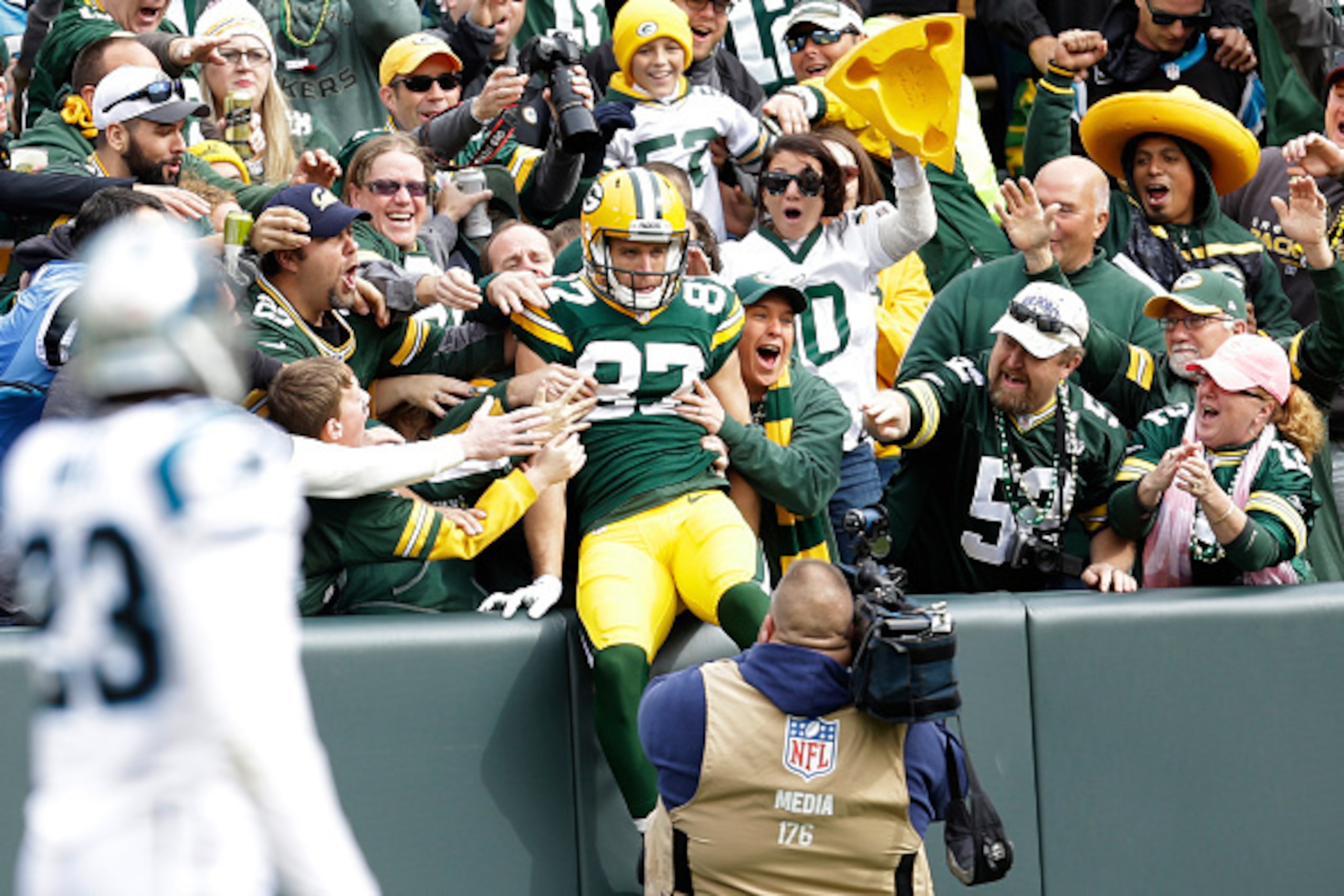 GREEN BAY, WI - OCTOBER 19: Jordy Nelson #87 of the Green Bay Packers does a Lambeau Leap after scoring a touchdown during the first quarter against the Carolina Panthers at Lambeau Field on October 19, 2013 in Green Bay, Wisconsin. (Photo by Mike McGinni