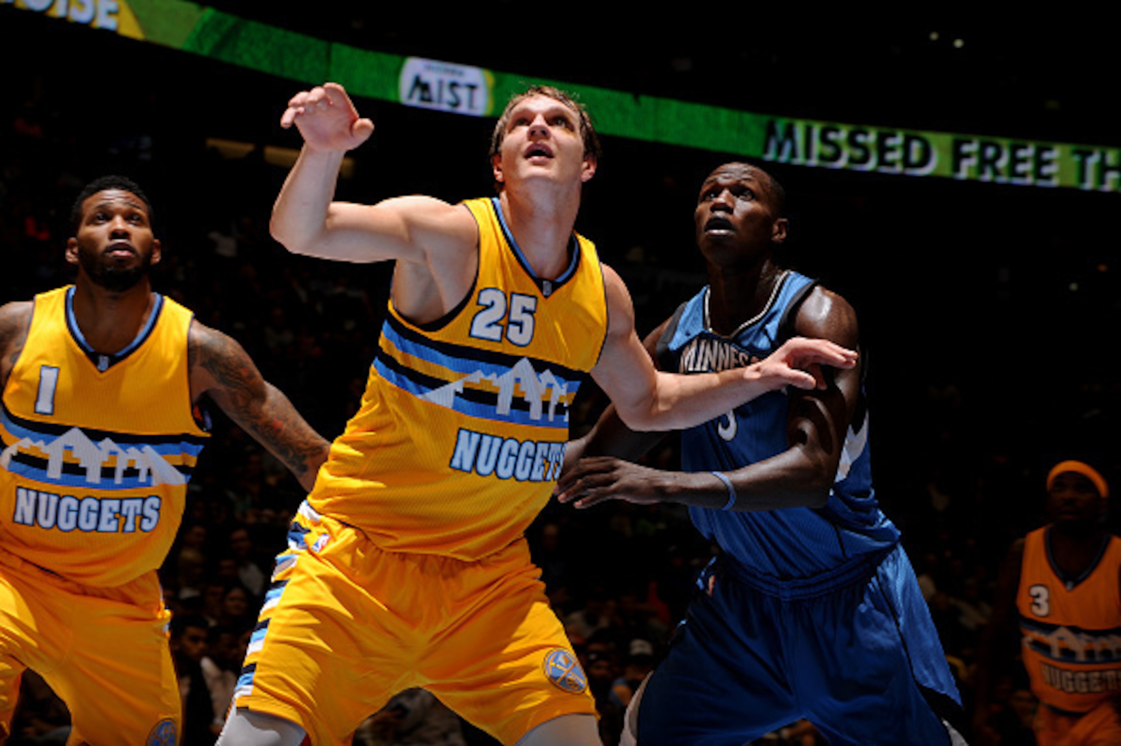 DENVER, CO - DECEMBER 26:  Timofey Mozgov #25 of the Denver Nuggets battles for position with Gorgui Dieng #5 of the Minnesota Timberwolves on December 26, 2014 at the Pepsi Center in Denver, Colorado. NOTE TO USER: User expressly acknowledges and agrees 