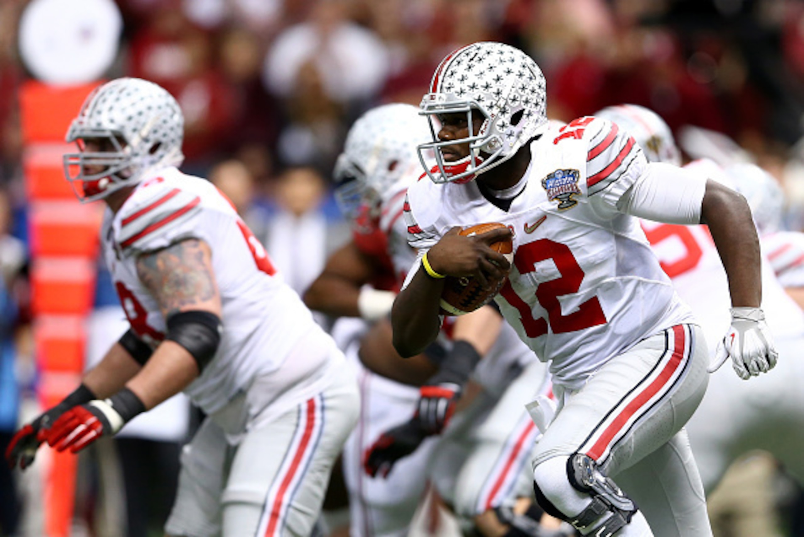 NEW ORLEANS, LA - JANUARY 01:  Cardale Jones #12 of the Ohio State Buckeyes in action against the Alabama Crimson Tide during the All State Sugar Bowl at the Mercedes-Benz Superdome on January 1, 2015 in New Orleans, Louisiana.  (Photo by Streeter Lecka/G